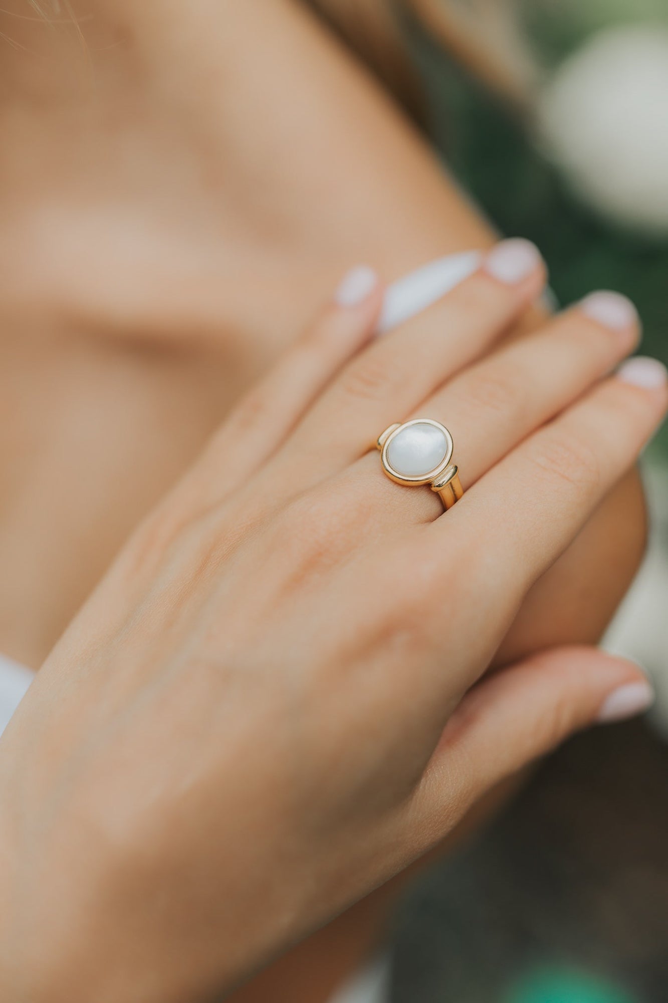 Detail view of the Broadwater ring's polished band and bezel setting, emphasizing the refined finish and smooth profile for comfortable wear.