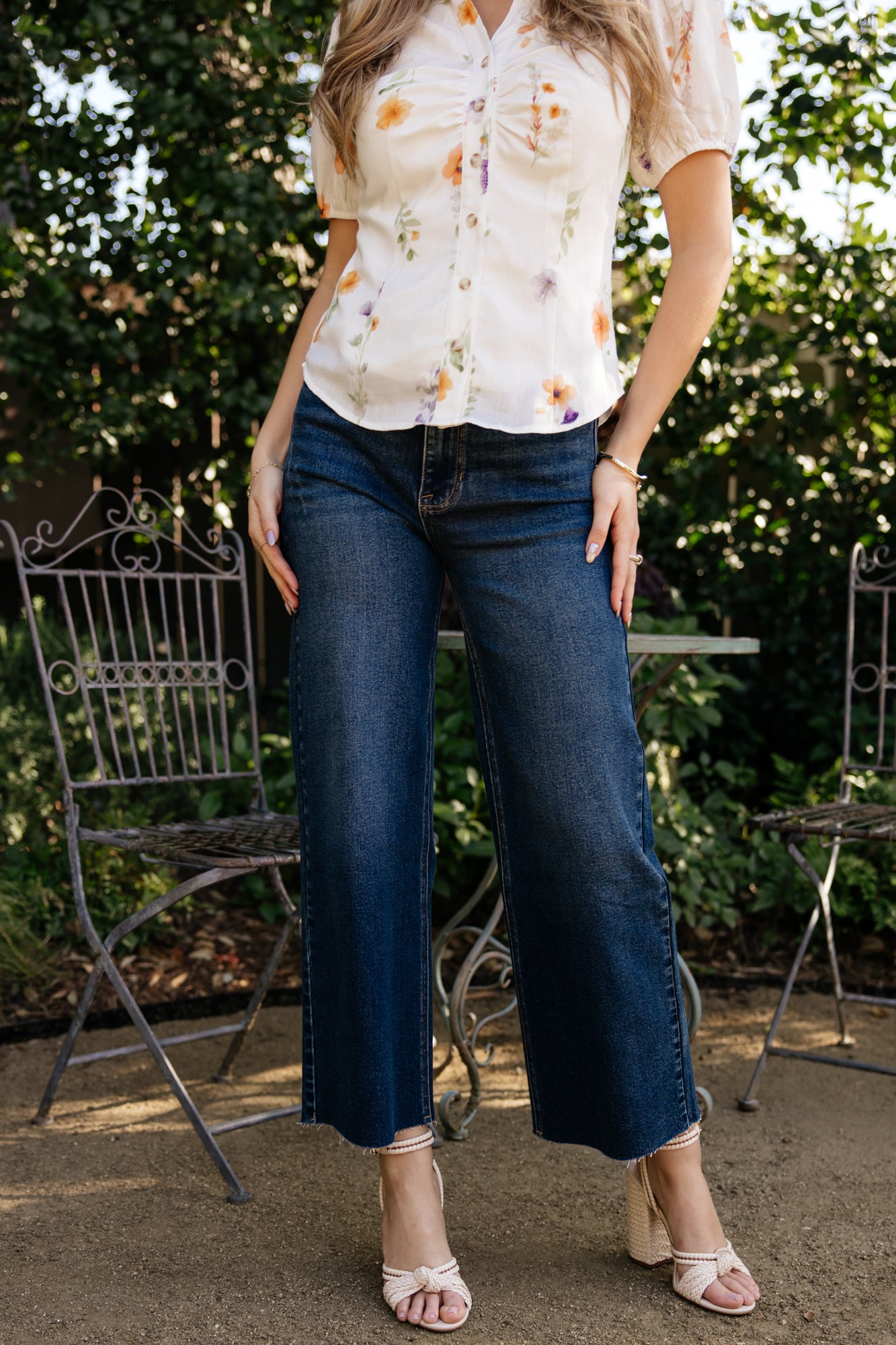 Close-up of the front pocket area and subtle distressing on the right front pocket of the dark wash Kirby high-rise wide-leg jeans.