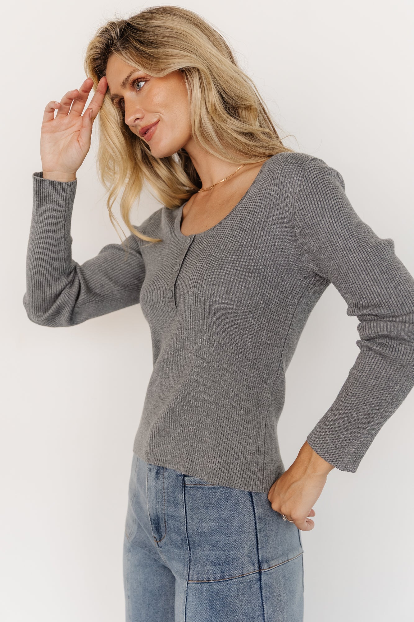 Close-up of Leo Henley Top button detail and ribbed texture, highlighting the viscose blend and stitch finish.