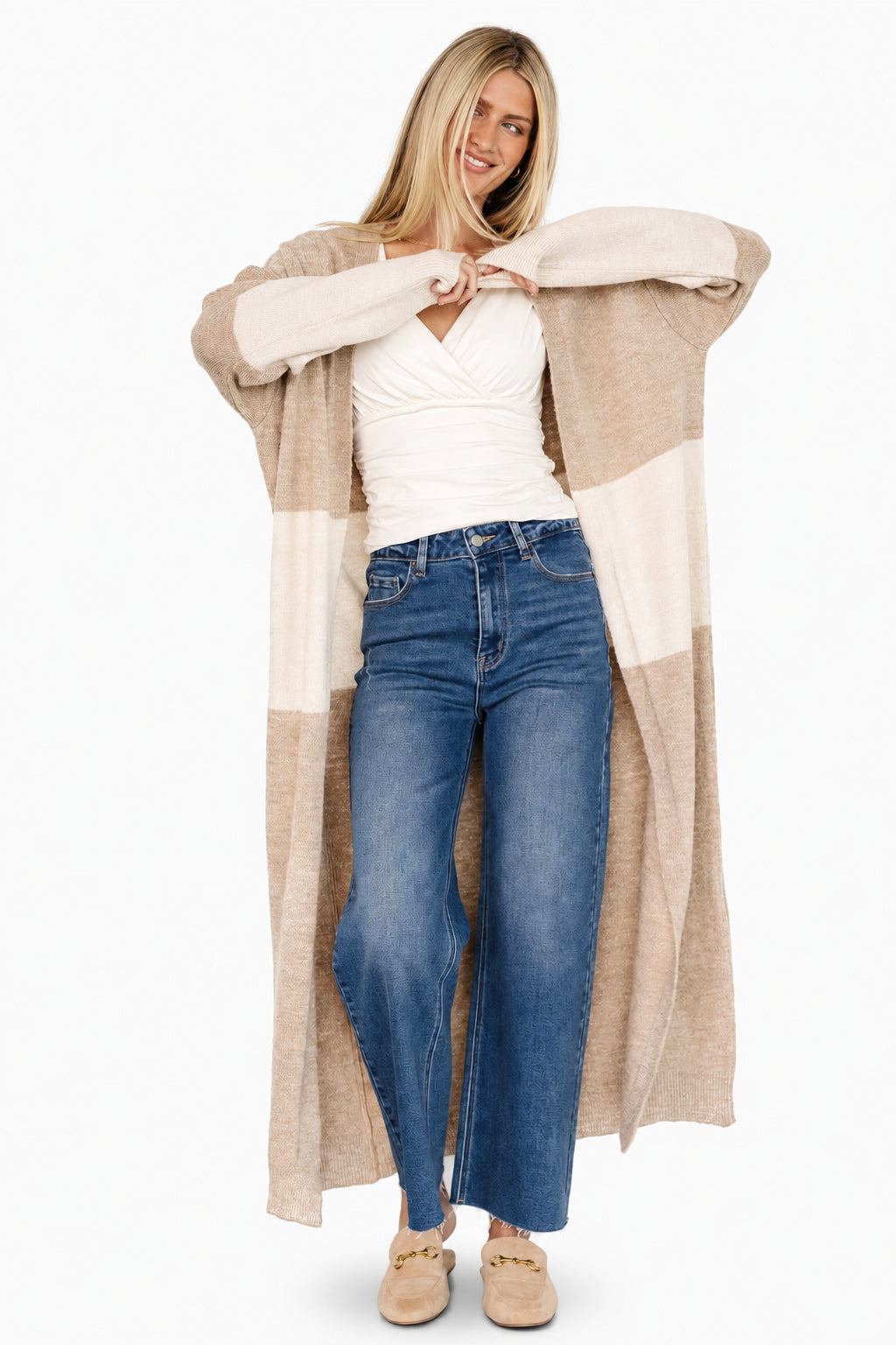 Lifestyle image of Thea duster cardigan worn over a dress, highlighting longline coverage, soft drape, and versatile styling options.