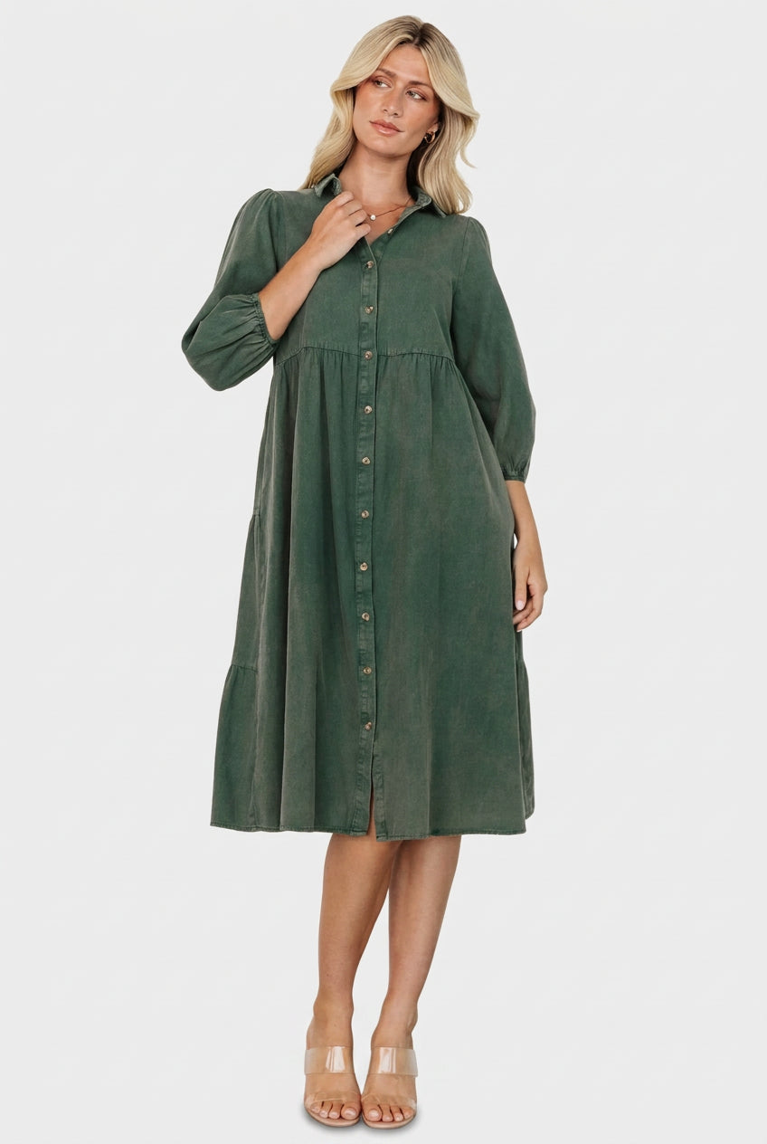 Casual styling shot of the green Sari Babydoll Dress paired with boots, showing length, movement, and easy everyday wearability.