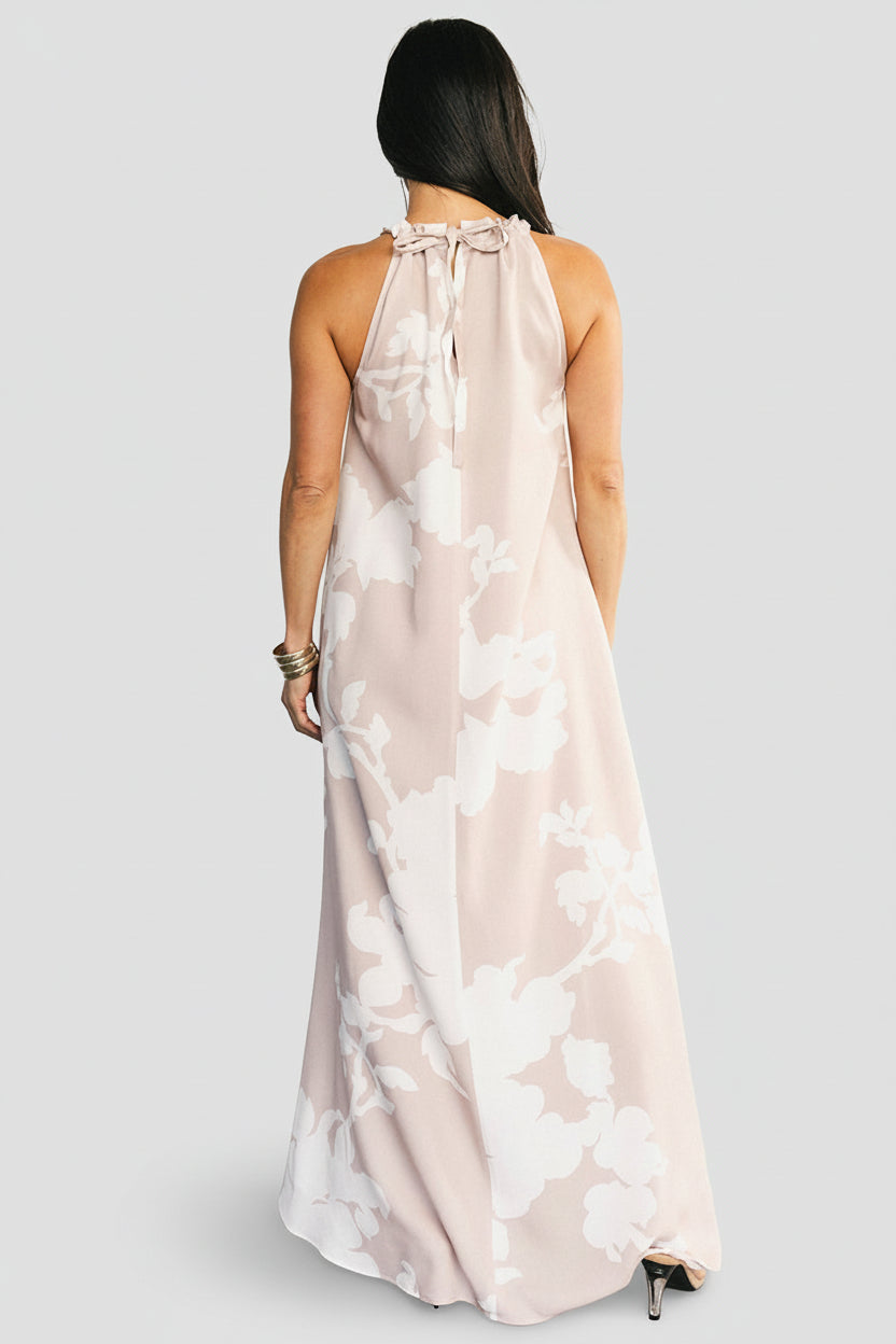 Back detail of the Aurelia Halter Dress showing cinched keyhole, adjustable tie, and upper back coverage.