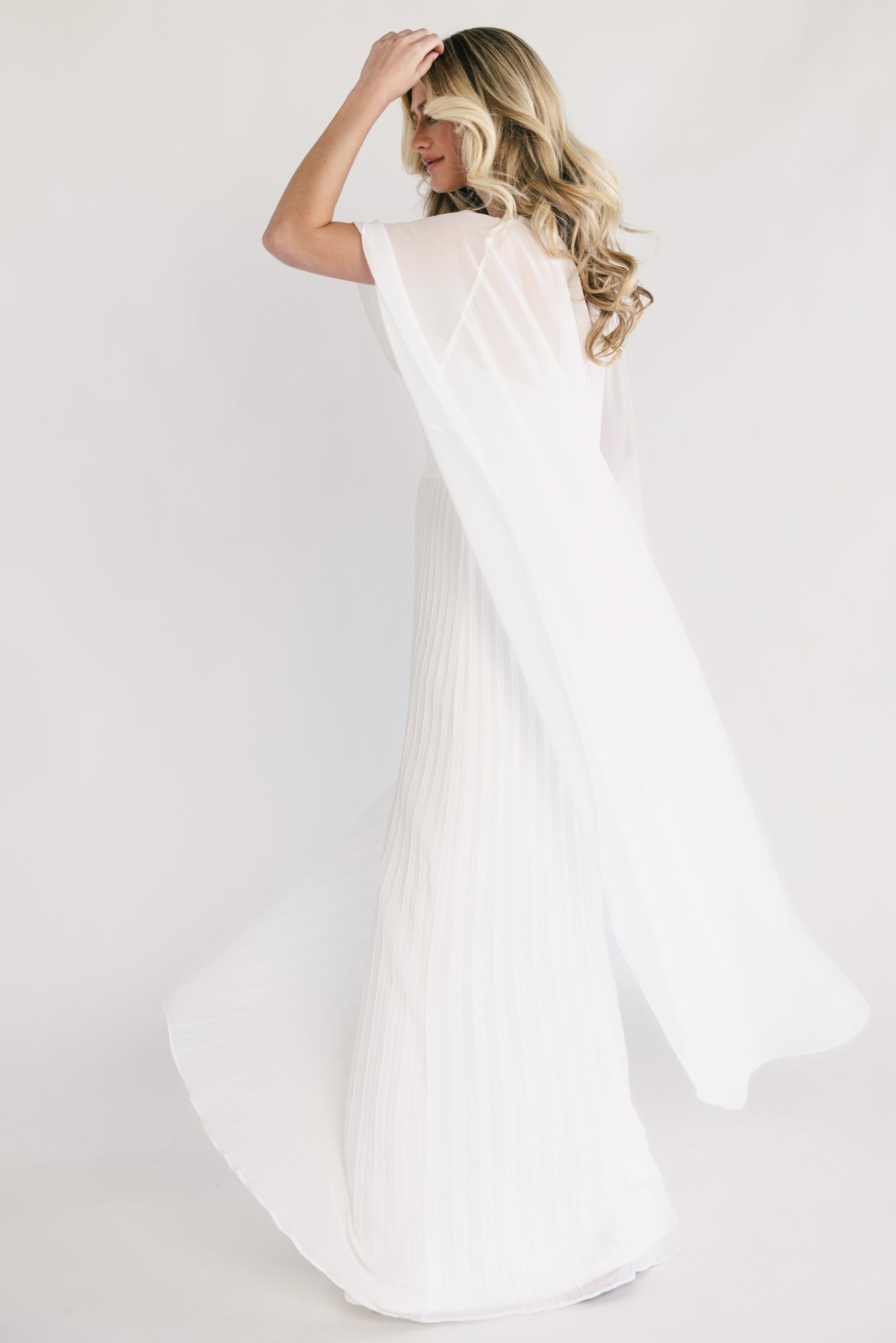 Close-up of the bodice showing strapless sweetheart neckline, fabric darts at bust, and silicone grip detail.