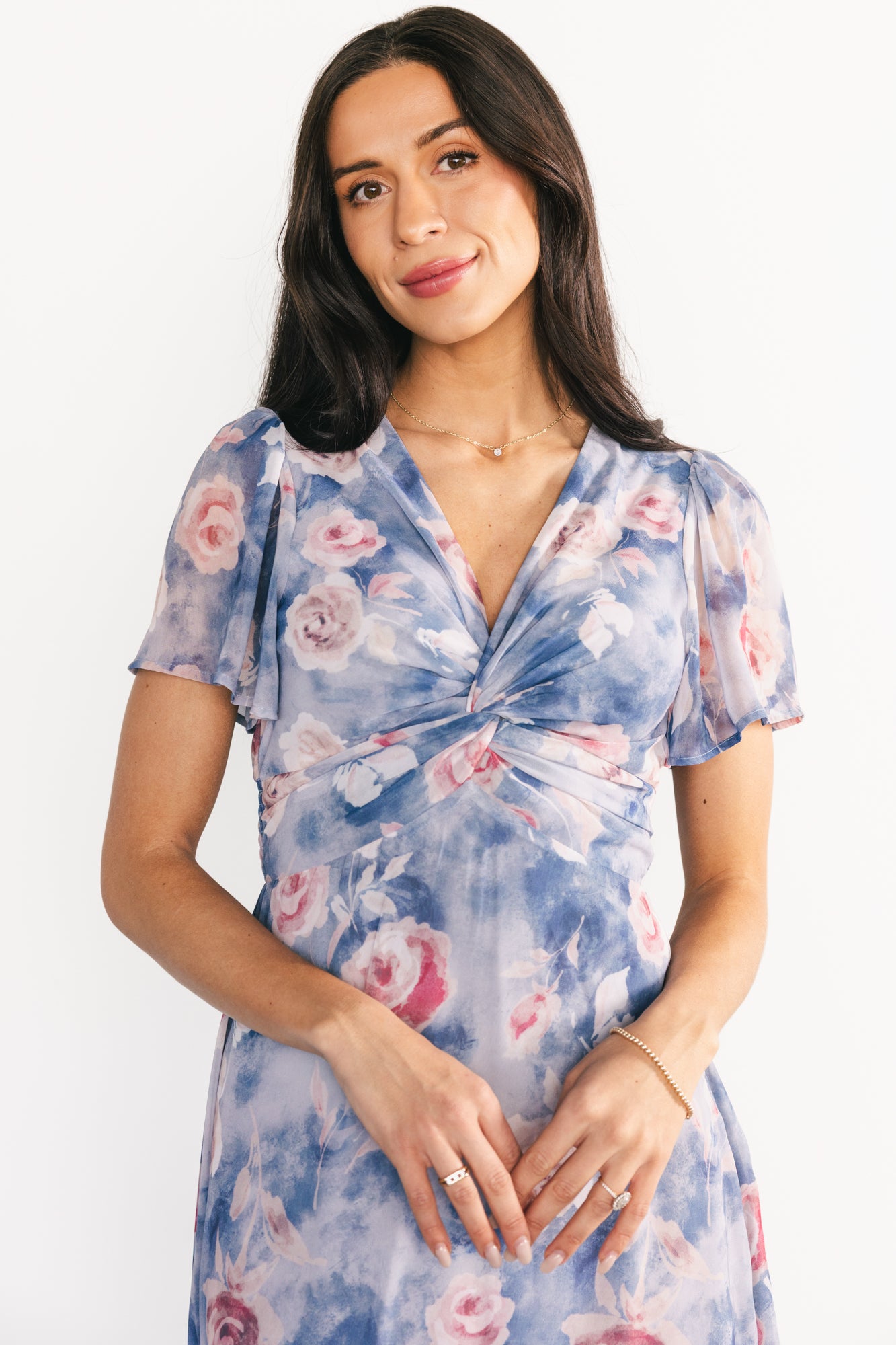 Full-length image of the Promise Maxi Dress on a model, showing the chiffon skirt movement, floral print placement, and overall maxi length.