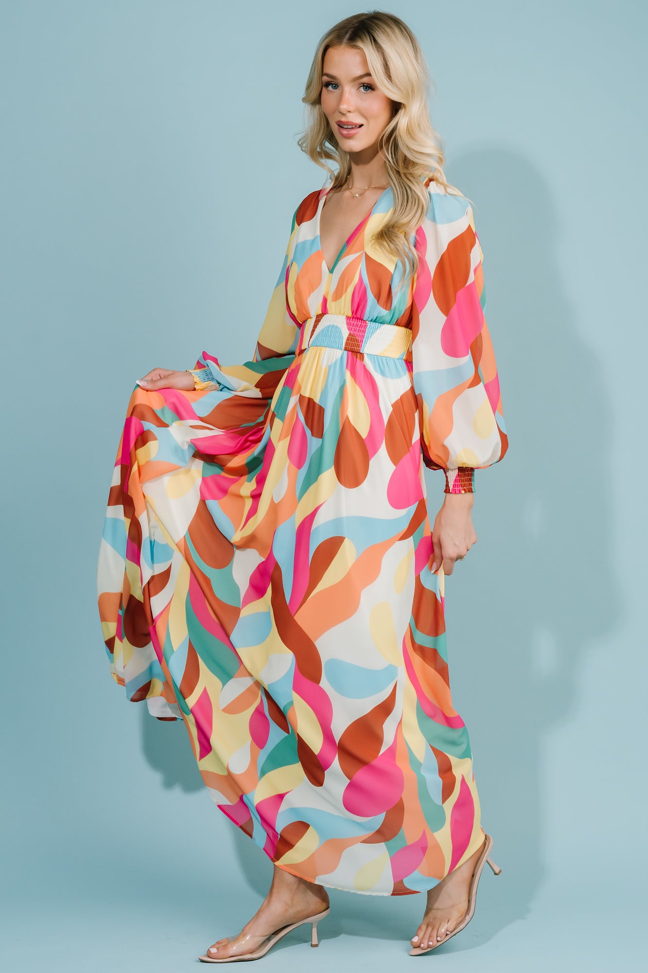 Detail shot of the printed fabric showing pattern scale, color mix, and lightweight chiffon texture up close.