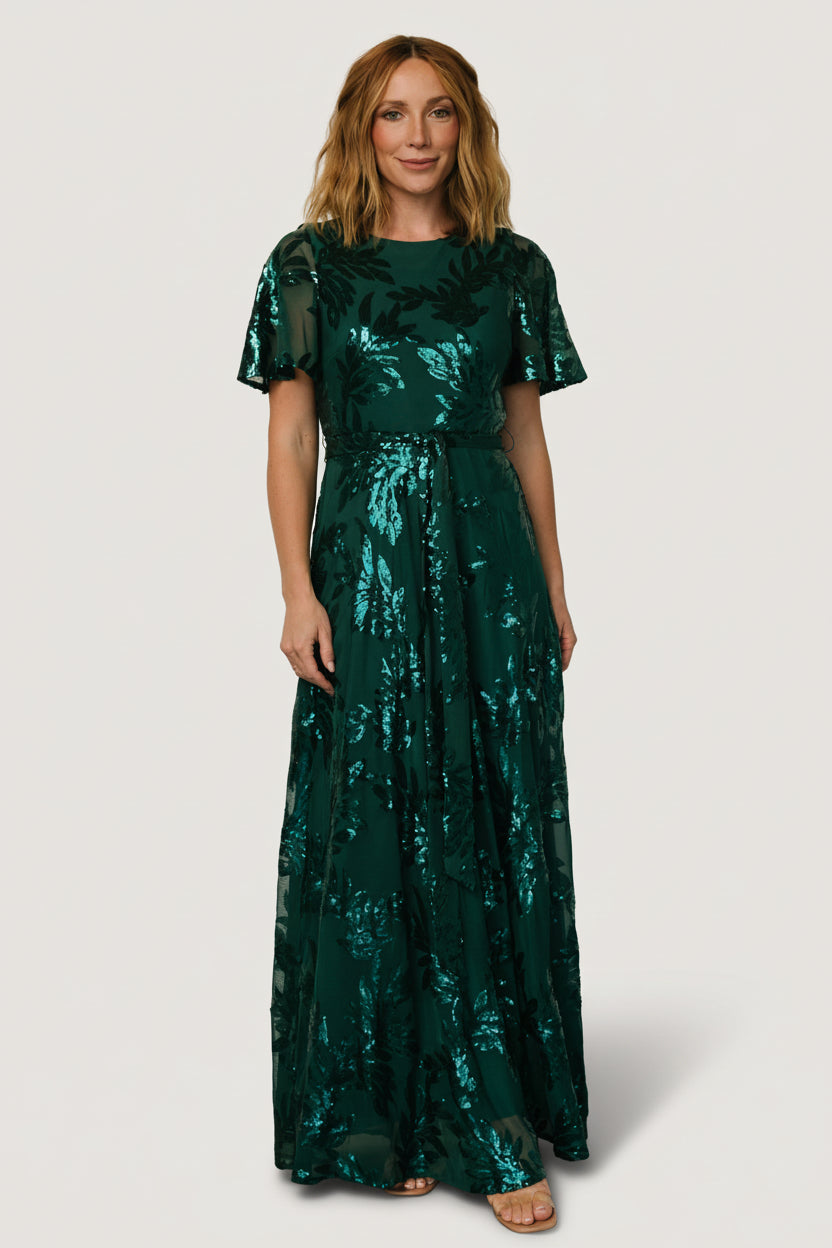Full-length studio image of Muse Sequin Maxi Dress in emerald, showing floor-length hem, sequin detail, and flowing silhouette suitable for formal events.