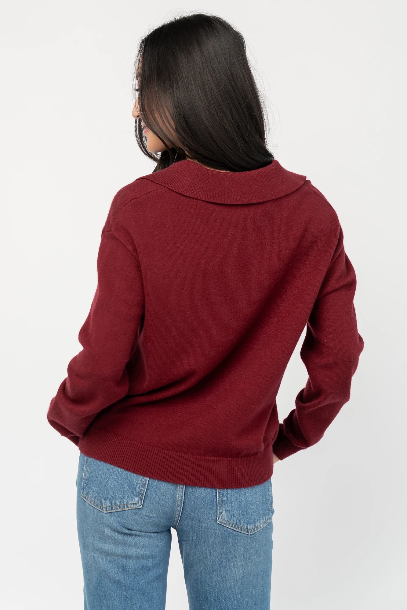 Bodhi Sweater with open rugby-style collar, dropped shoulders, long sleeves, and ribbed cuffs and hem.