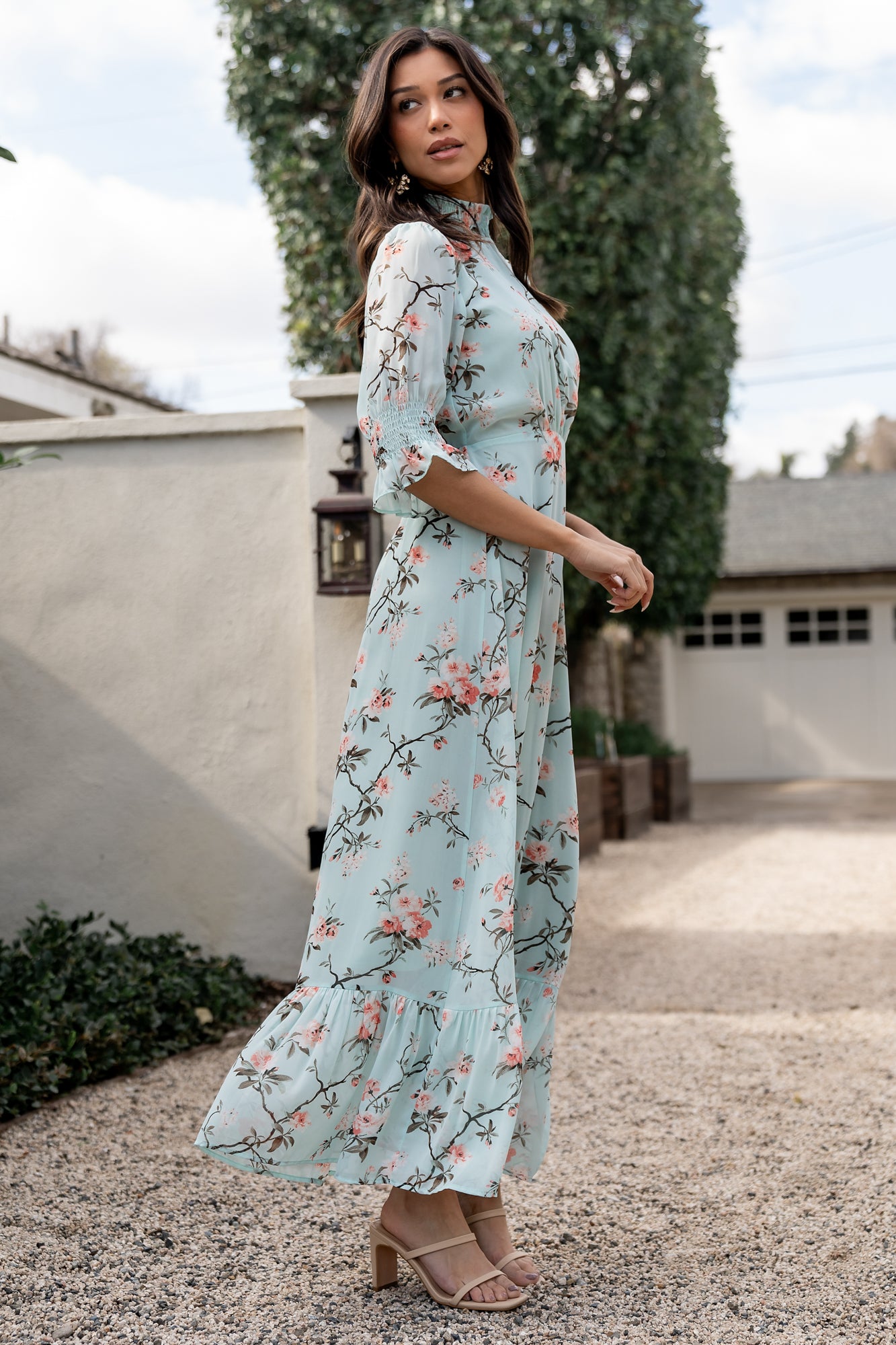 Studio shot of Marie Mock Neck Maxi Dress in sage floral, focusing on sleeve ruffle cuffs, keyhole back closure and delicate pleating at waist.