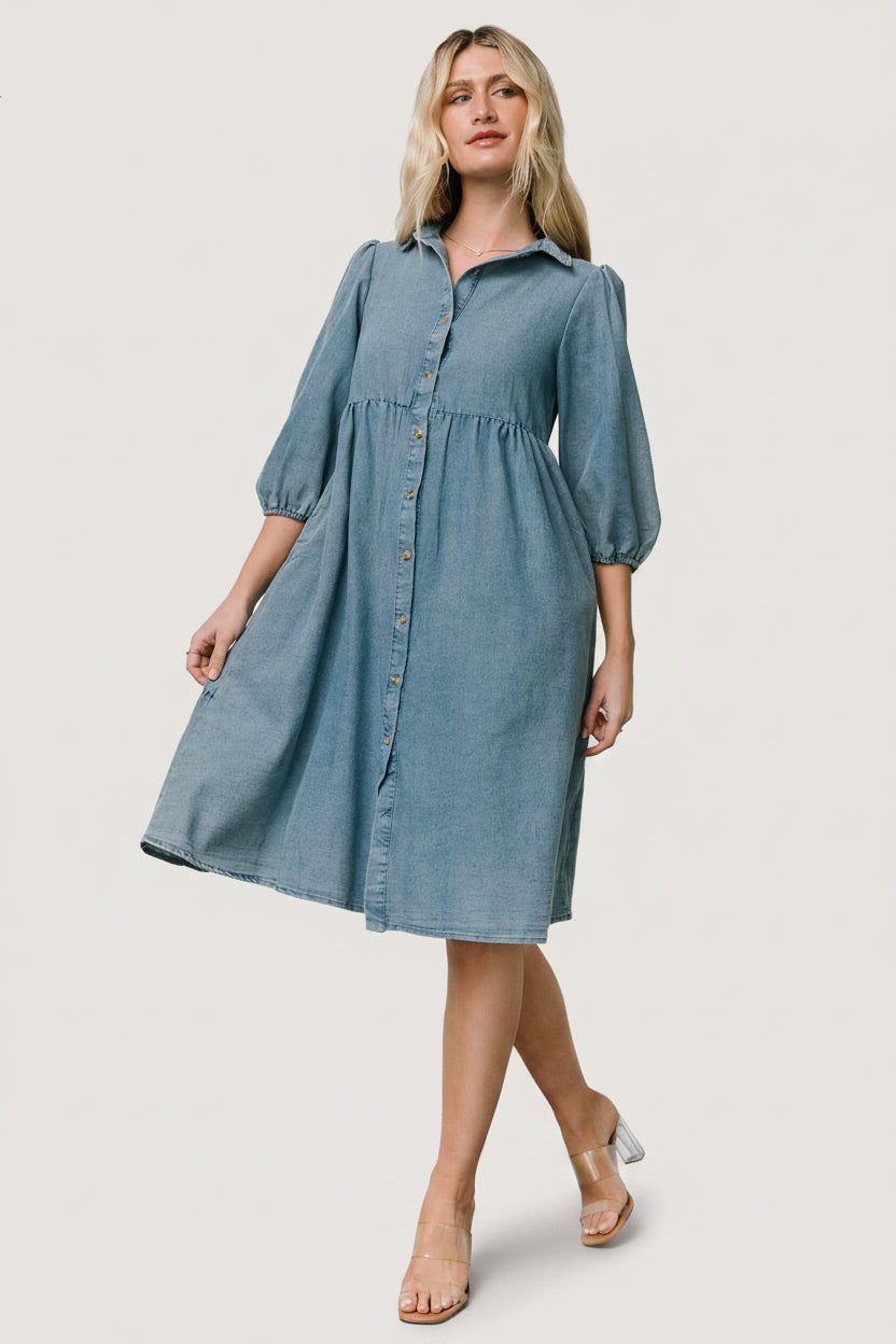 Back view of Sari Chambray Babydoll Dress showing gathered back tiers and roomy babydoll silhouette for comfortable layering.