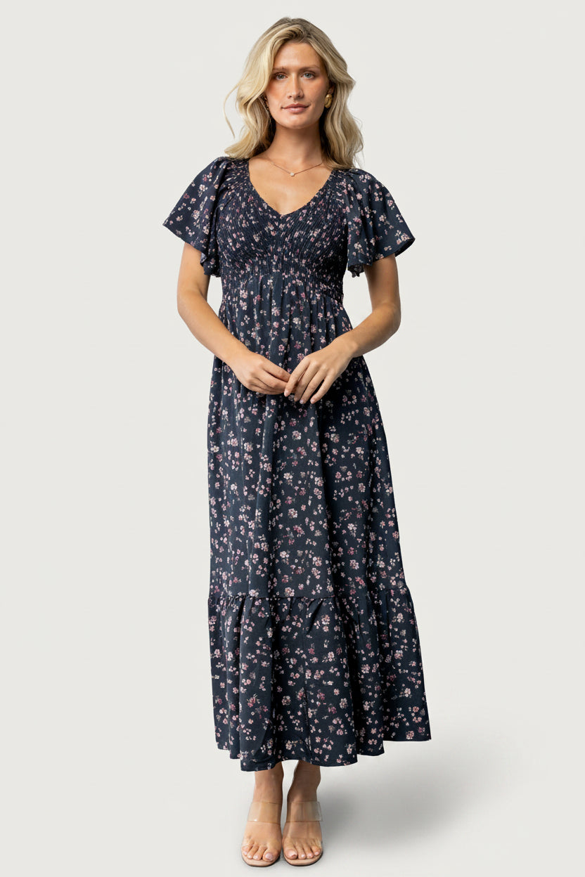 Model wearing Jerah Smocked Midi Dress in Midnight Floral, showing relaxed fit and how the dress falls to midi length.