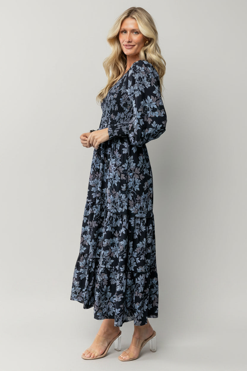 Back and hem detail of the Rayna Smocked Maxi Dress illustrating length, lining coverage, and gentle skirt tiers.