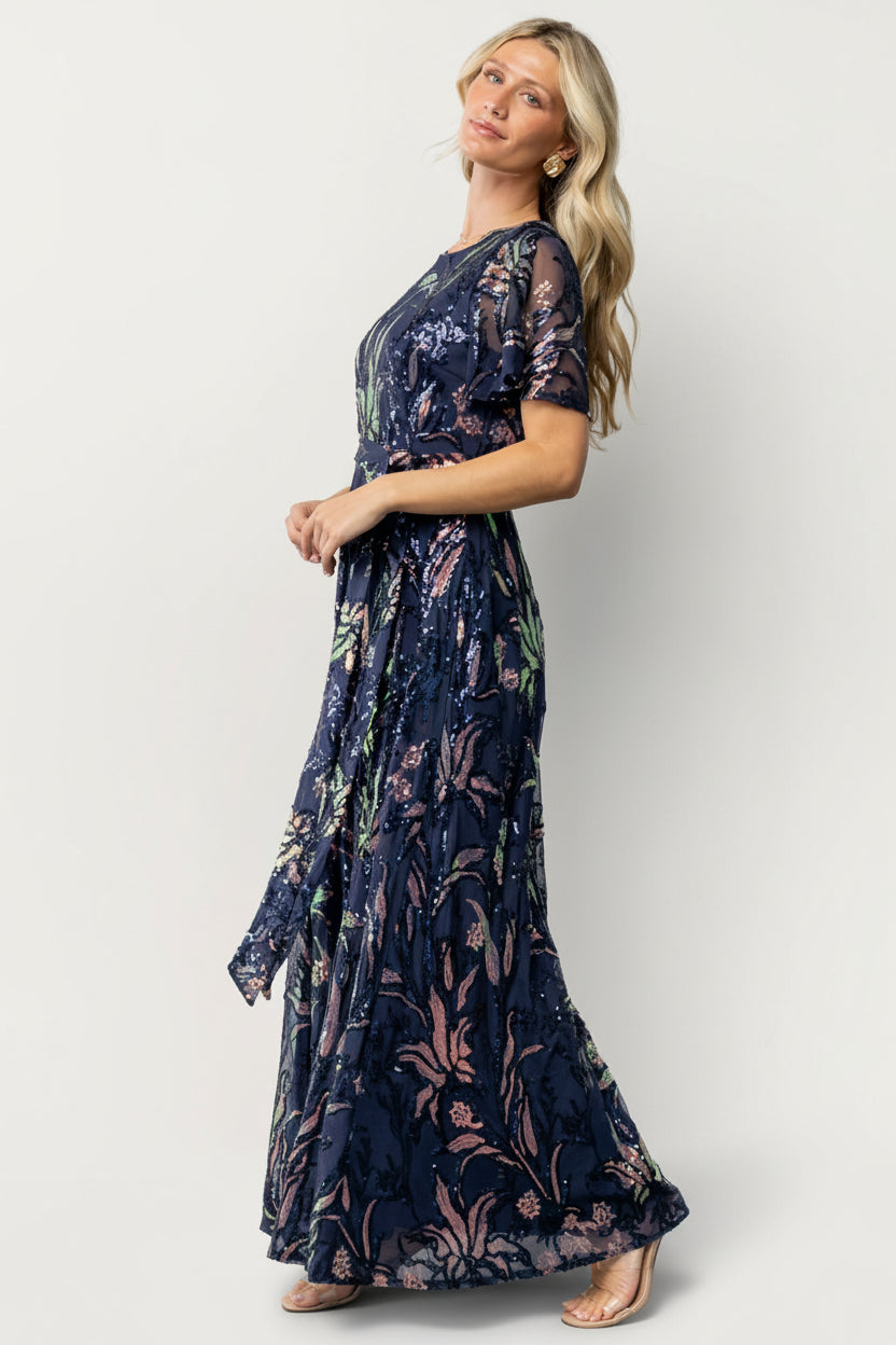 Detail view of the dress fabric and lining edge showing sequin placement, texture, and the high-quality finish of the Muse Sequin Maxi Dress.