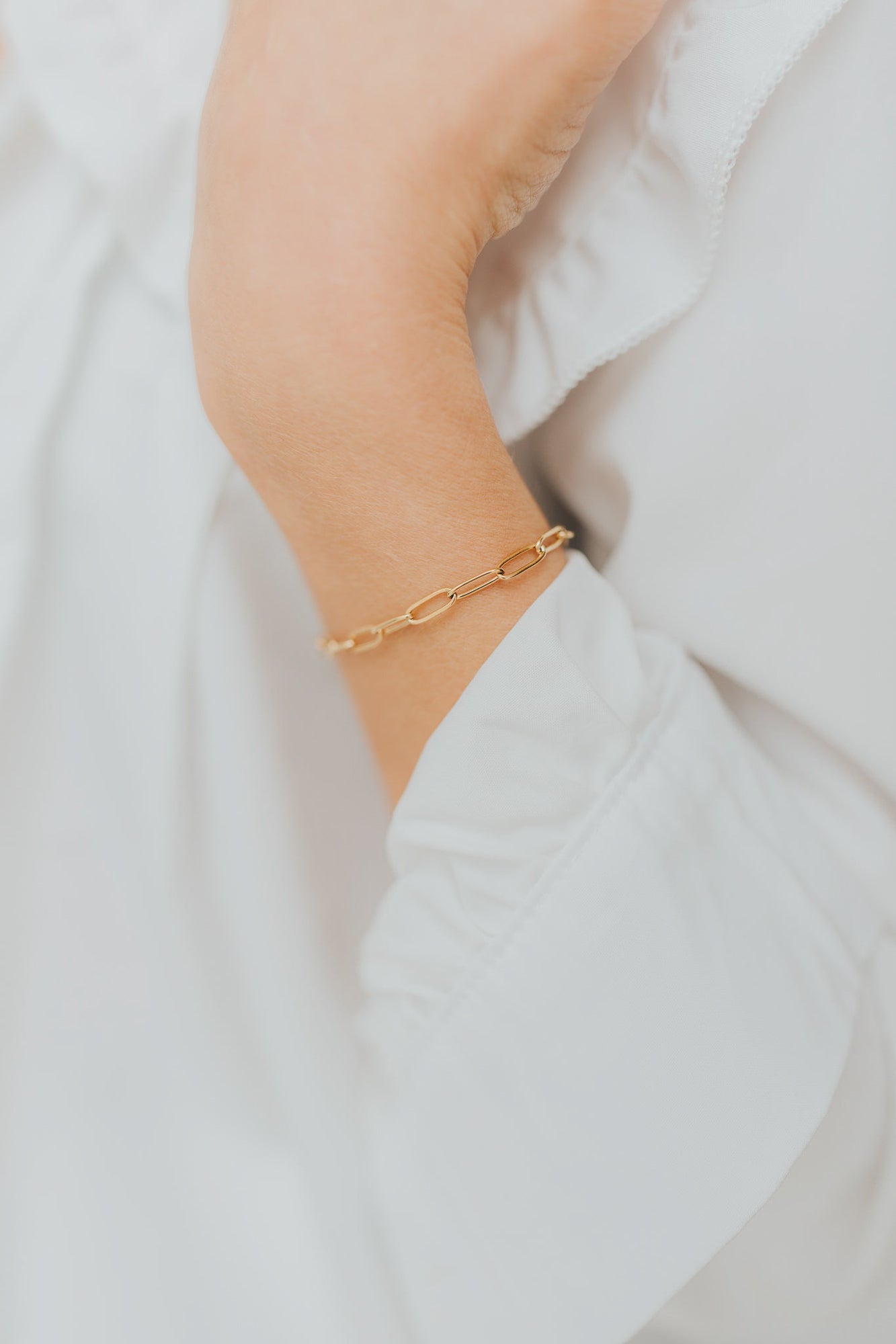 Detailed angle of Eloise Link Bracelet highlighting elongated gold-plated links and secure lobster clasp with extender visible.