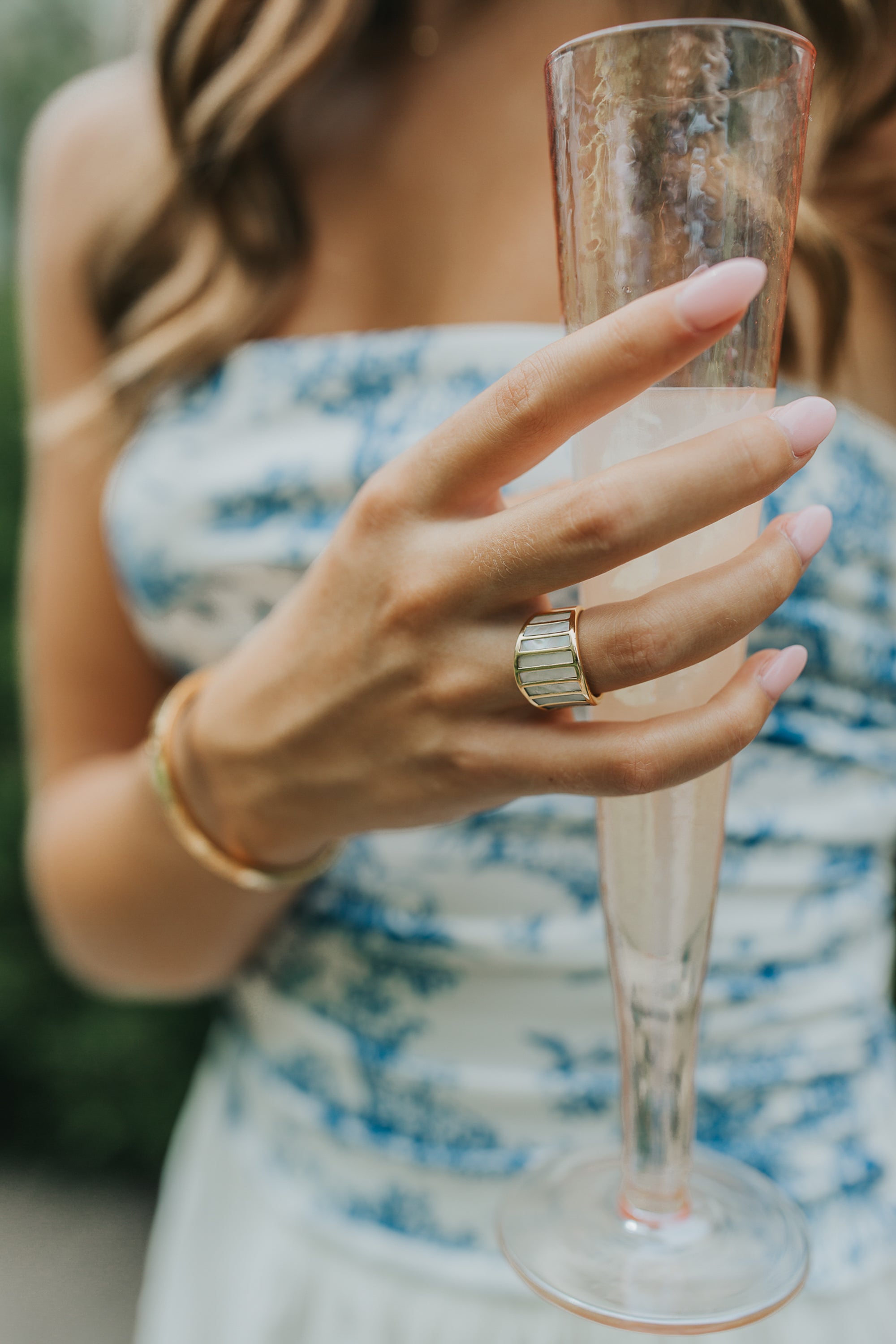 Side profile of the Alys ring emphasizing the band width, vertical panel seams, and the ring's comfortable, contoured interior.