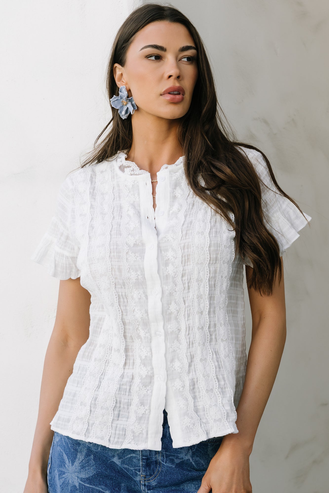 Studio flat-lay of the Zara Lace Top in white showing button-front detail, vertical lace trims at bust, and breathable cotton texture.