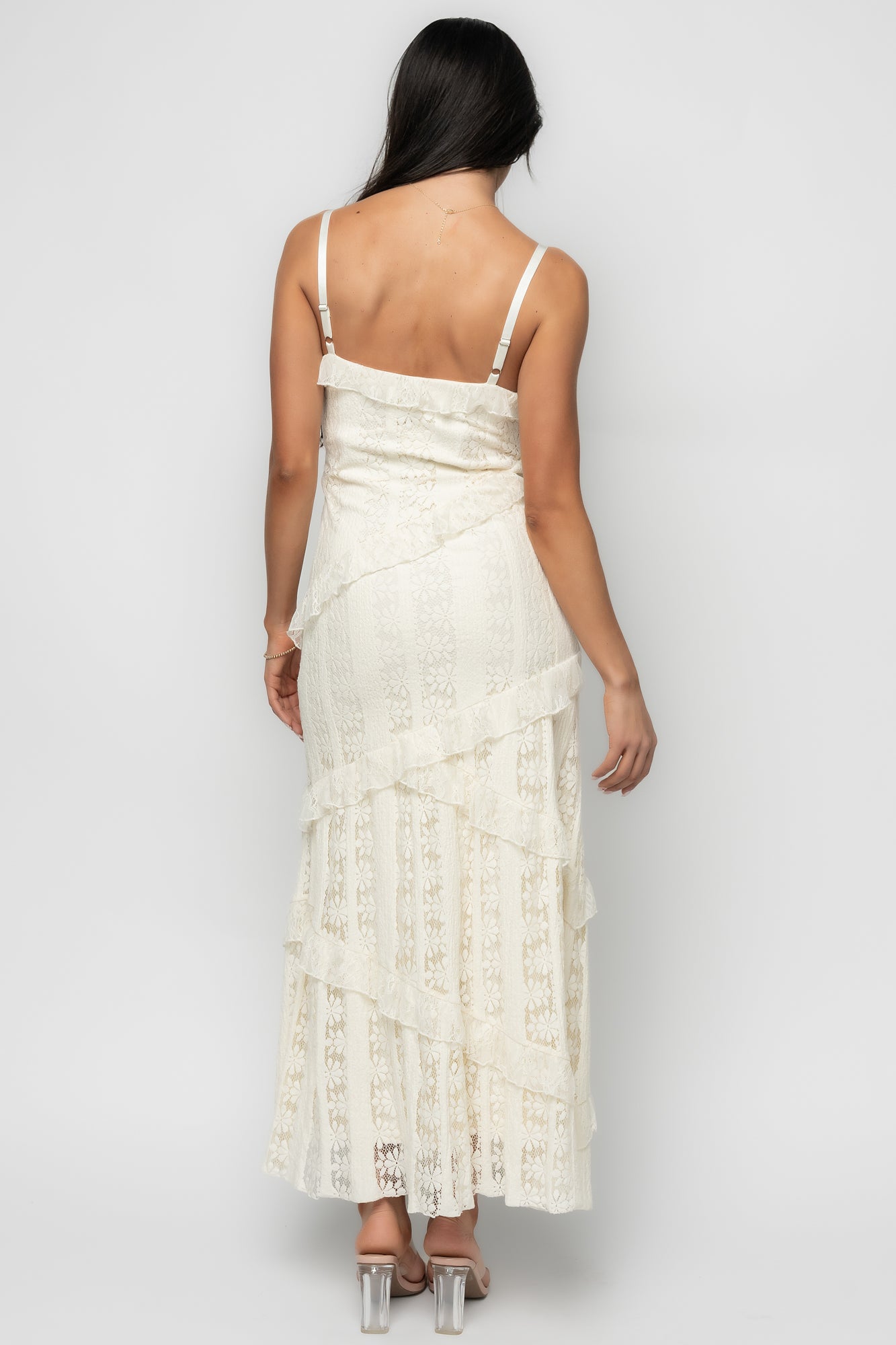 Model wearing Annabelle Lace Maxi Dress in cream styled with sandals, demonstrating length, drape, and movement of the tiered lace skirt.