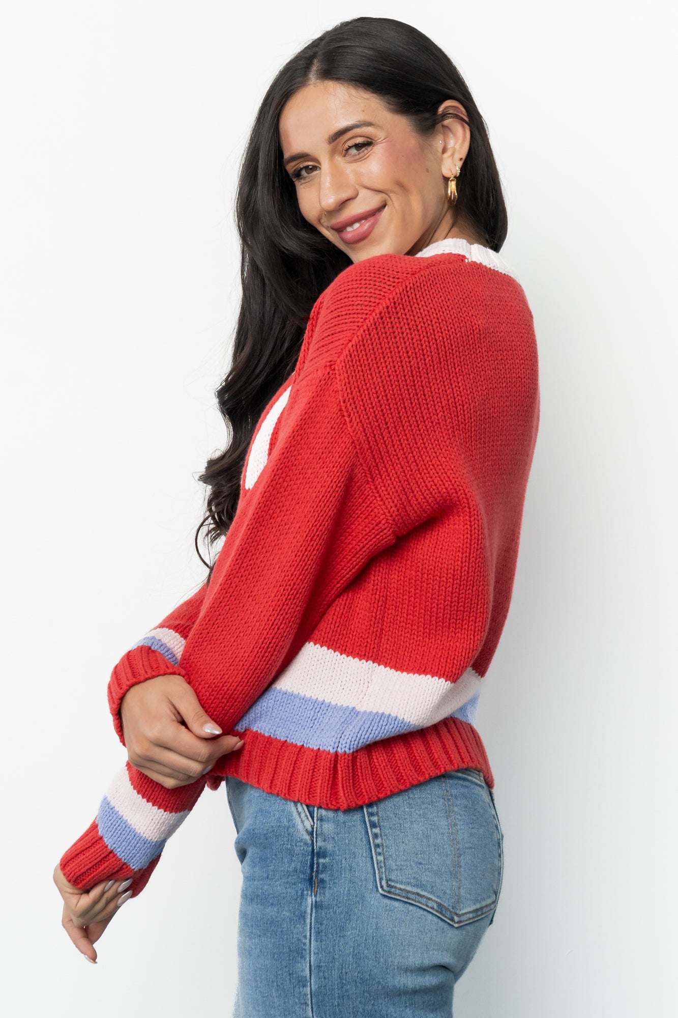 Side and back view of the red multi Gilli ski sweater highlighting length, sleeve drop, and overall fit on the body for styling reference.