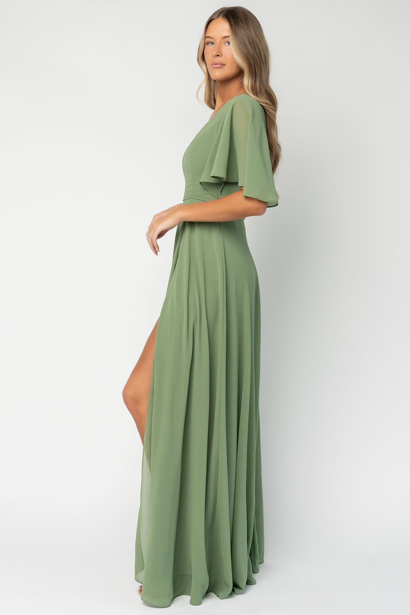 Back view of Valetta maxi dress in olive showing V-back detail and clean back zipper closure for a smooth finish.