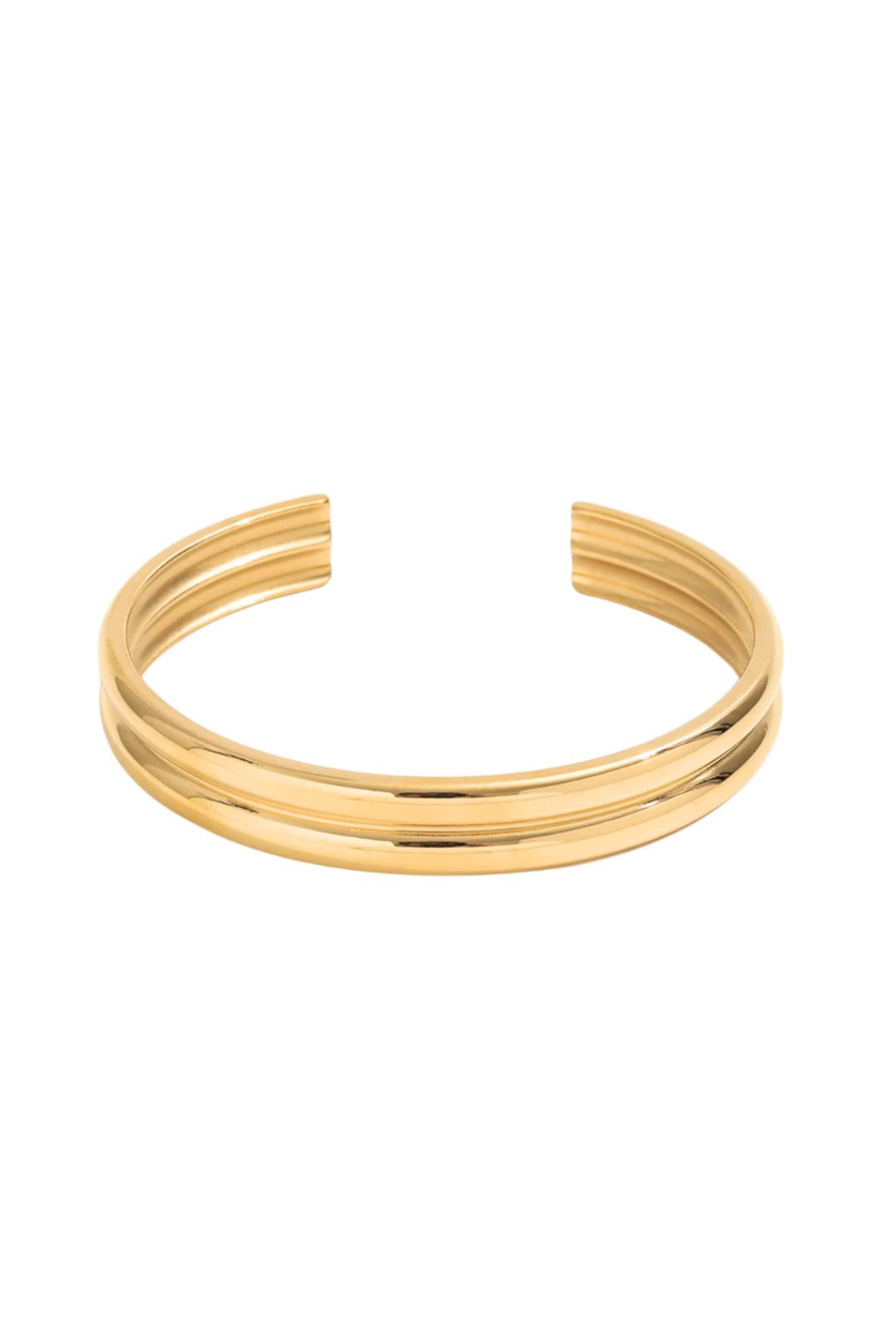 Front view of The Bailey Band showing the double-bar silhouette and high-shine gold-tone finish on surgical-grade base metal.