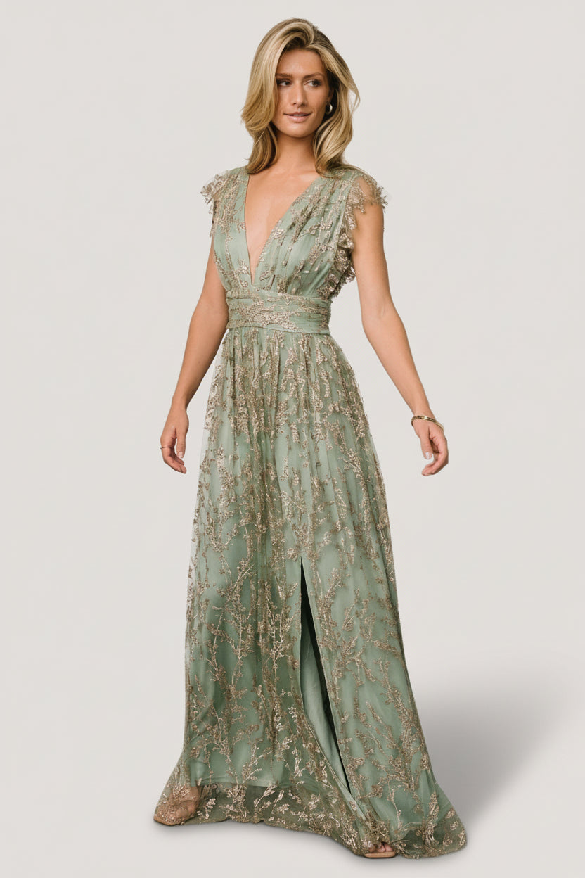 Full-length shot highlighting the left-side leg slit and skirt movement of the Arlene Shimmer Gown in sage and gold.