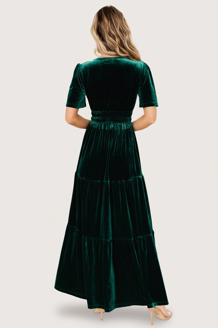Close-up of short flutter sleeve and velvet texture on the Artemis emerald maxi dress, with subtle sheen and rich color.