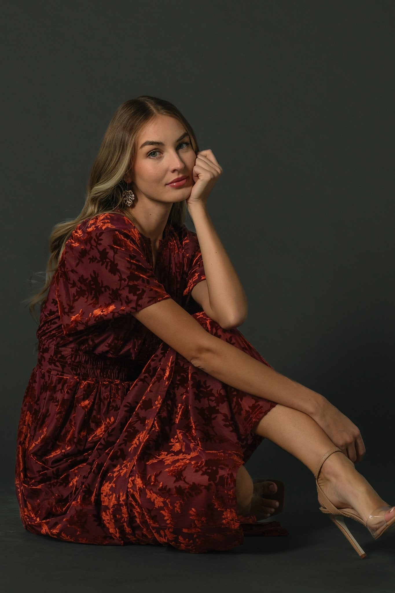Detail shot showing smocked waistband and gathered bodice on the Bronwyn burnout velvet midi dress, emphasizing shaping and texture.