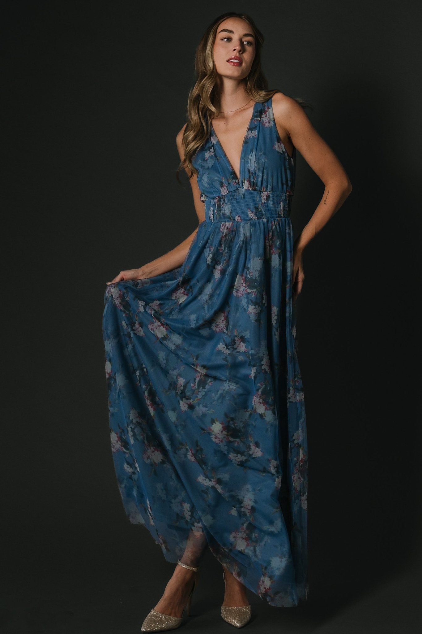 Close-up of bodice and smocked waist on Kamila Tulle Maxi Dress, showing fabric texture, deep V-neckline, and delicate floral pattern details.