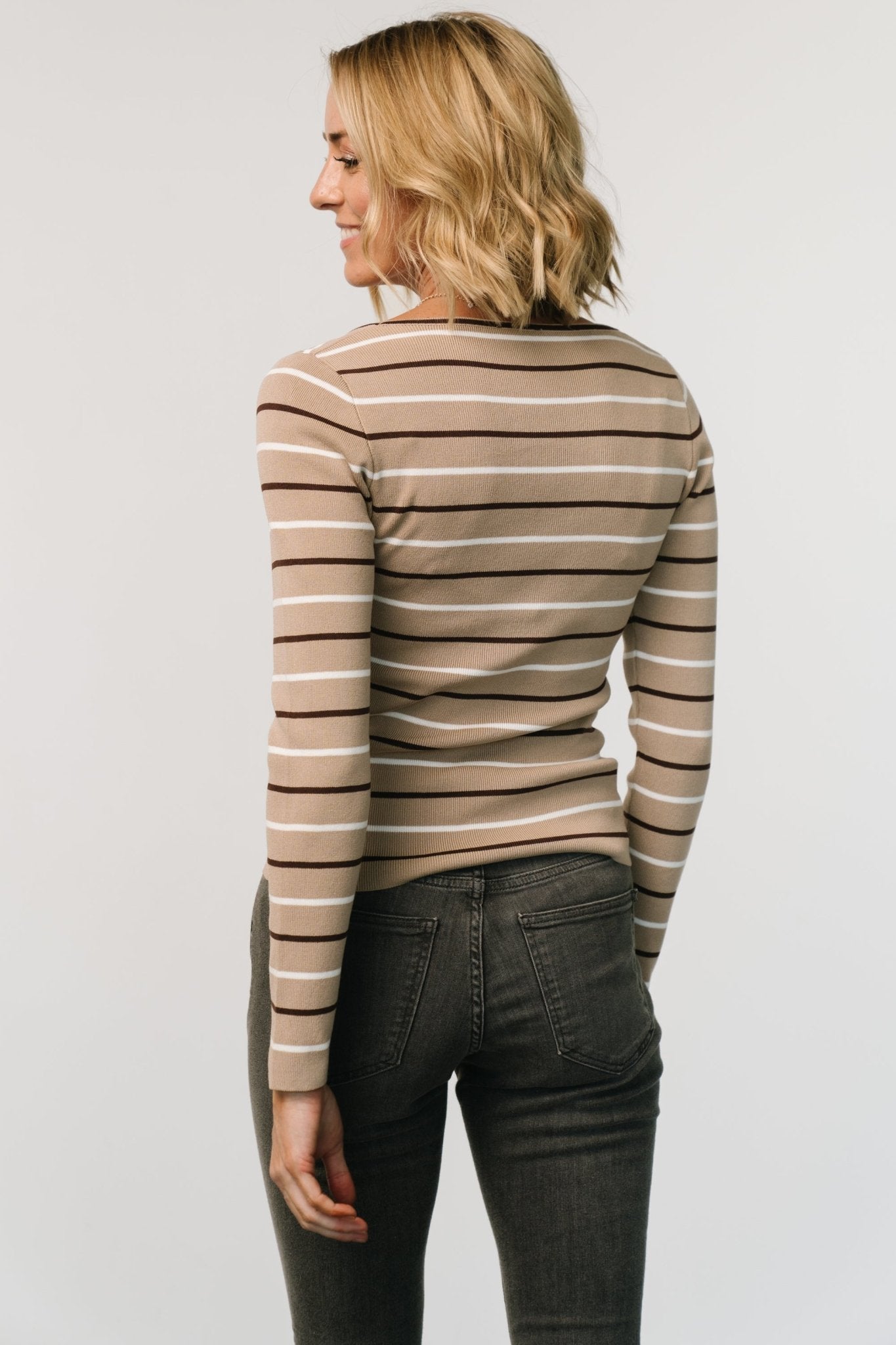 Back and sleeve detail of fitted Kaylee taupe stripe top, illustrating slim sleeve fit and smooth knit finish suitable for layering.