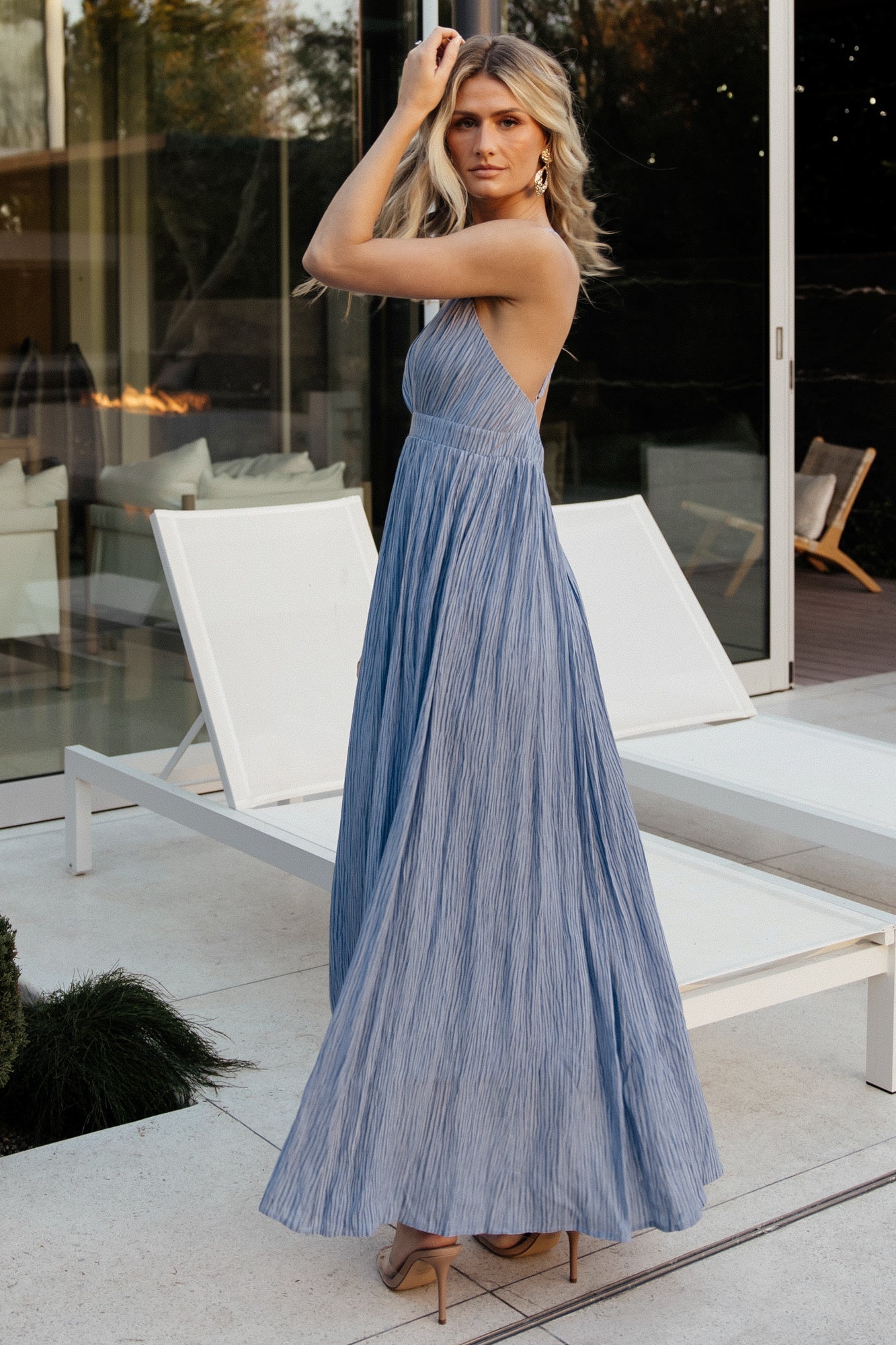 Back view of Korley Maxi Dress in blue stripe highlighting open crossover back, hidden zipper and flowing lined maxi skirt.