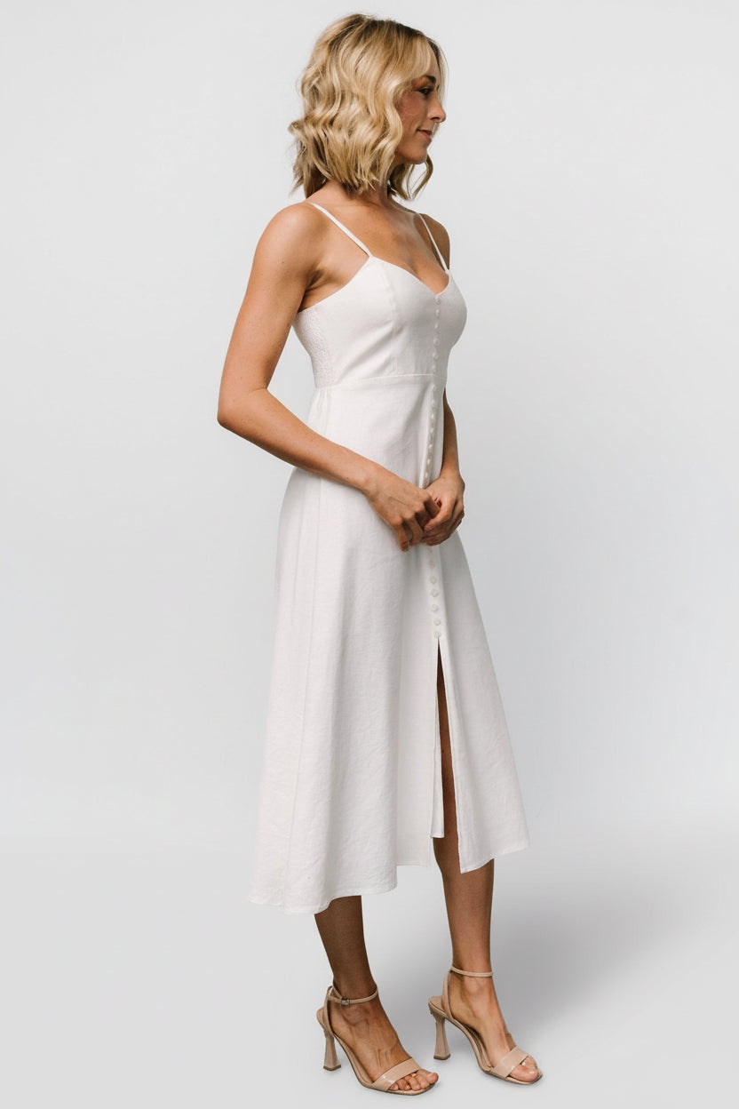 Interior view focusing on the fully lined construction and smooth inner finish of the ivory cotton-linen midi dress for comfortable wear.