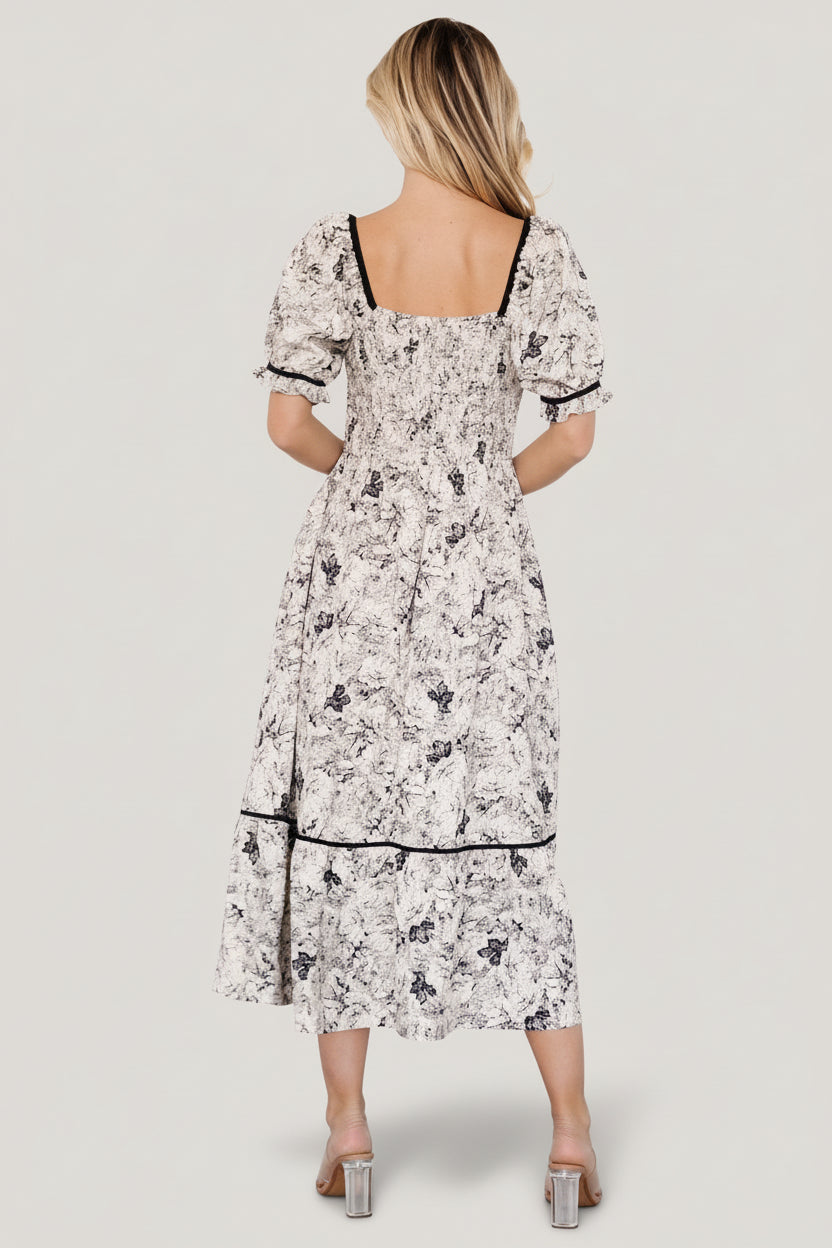 Side view of Mariana Midi Dress showing smocked back bodice, elastic at natural waist, hidden side pocket, and tiered midi hem.