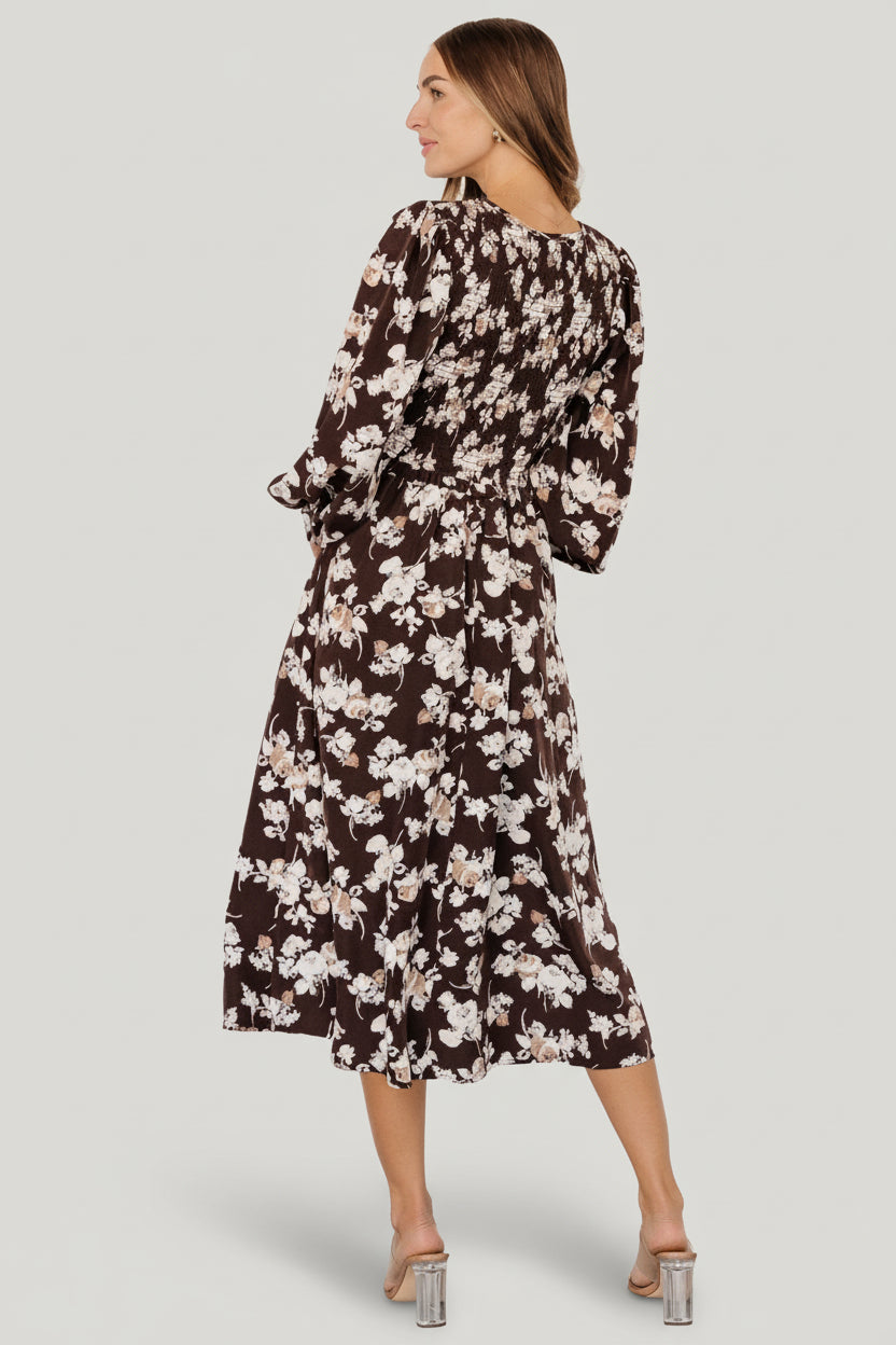 Model Casey (5'8", size 2) wearing size S brown floral smocked midi dress, styled with neutral footwear for scale and fit reference.