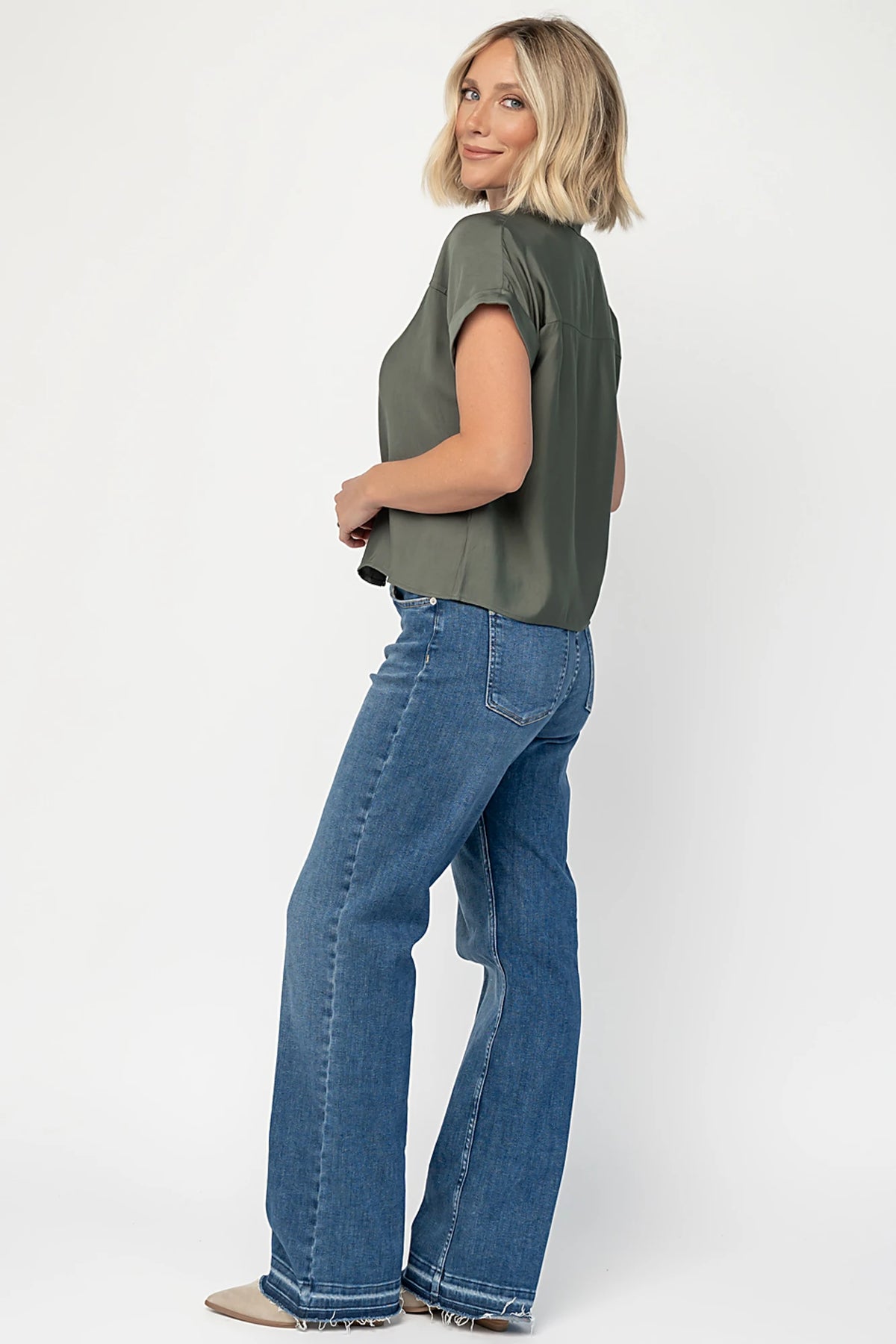 Miriam Top in Dark Sage with collared neckline, concealed button front, cuffed short sleeves, and relaxed silhouette.