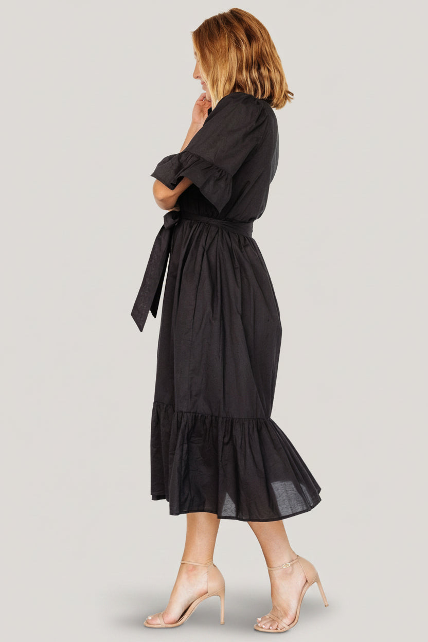 Side view of the Mirielle midi dress illustrating the comfortable A-line skirt and accessible side pockets.