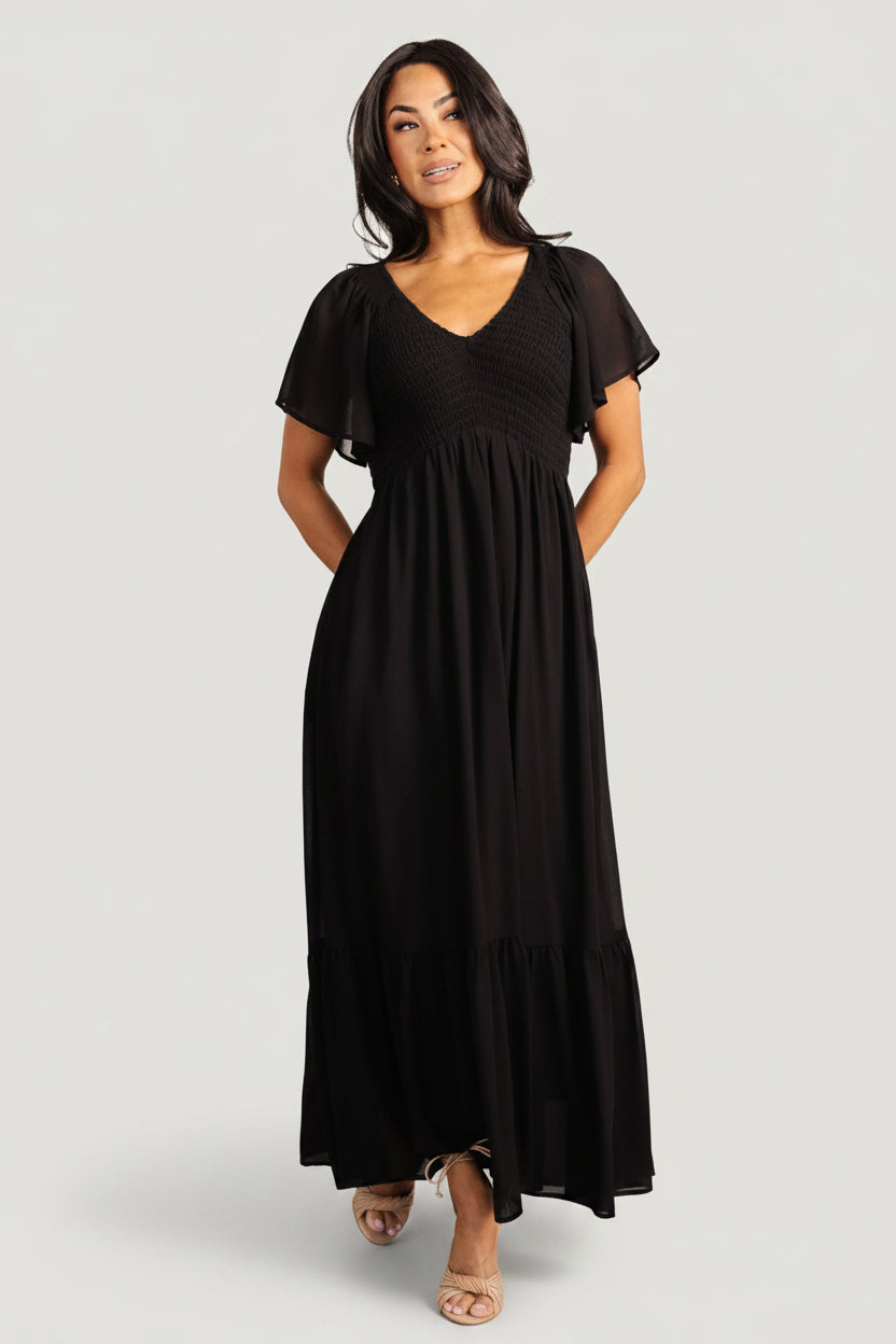 Fabric texture close-up of black chiffon overlay and lining for the Monica Smocked Maxi Dress, emphasizing lightweight drape.