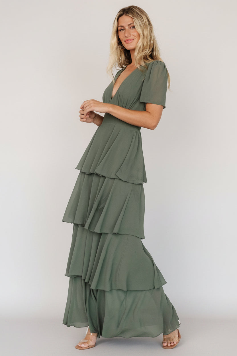 Styled detail photo of the Montaigne Ruffle Maxi Dress in Dark Sage focusing on ruffle movement, sleeve shape and the elegant V-neck silhouette in chiffon.