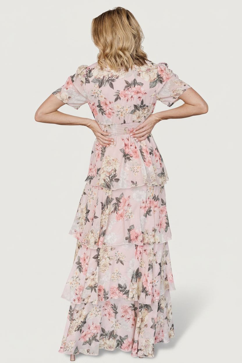 Styled outfit shot of the Montaigne maxi dress paired with heels, demonstrating length, movement, and event-ready styling for occasions.
