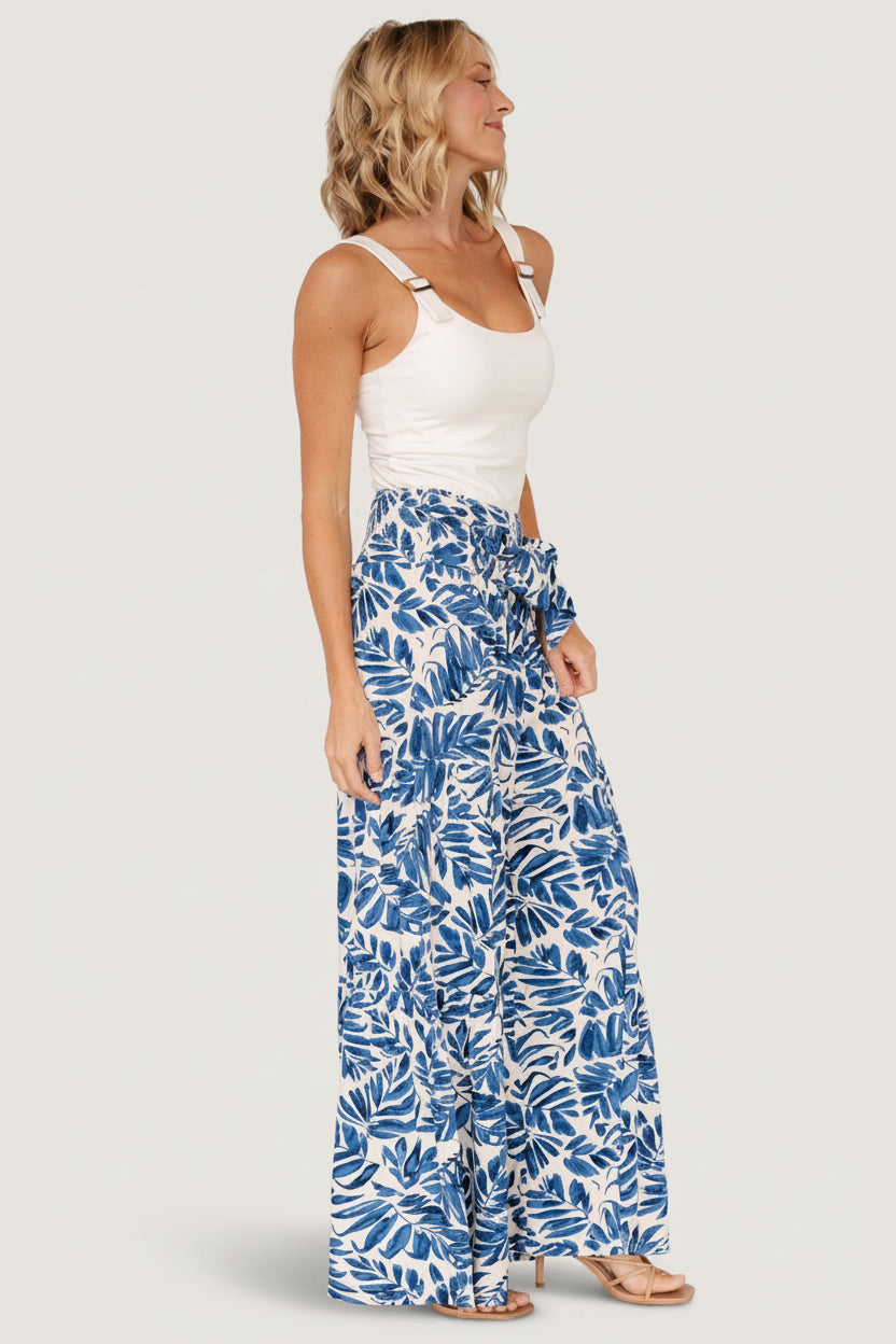 Detail shot of Monterey fabric showing blue-and-ivory tropical print, lightweight rayon texture, and soft flowing drape.