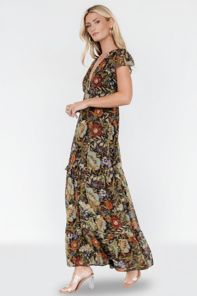 Close-up of textured chiffon and dotted shimmer with multi-color floral details and smocked shoulder trim.