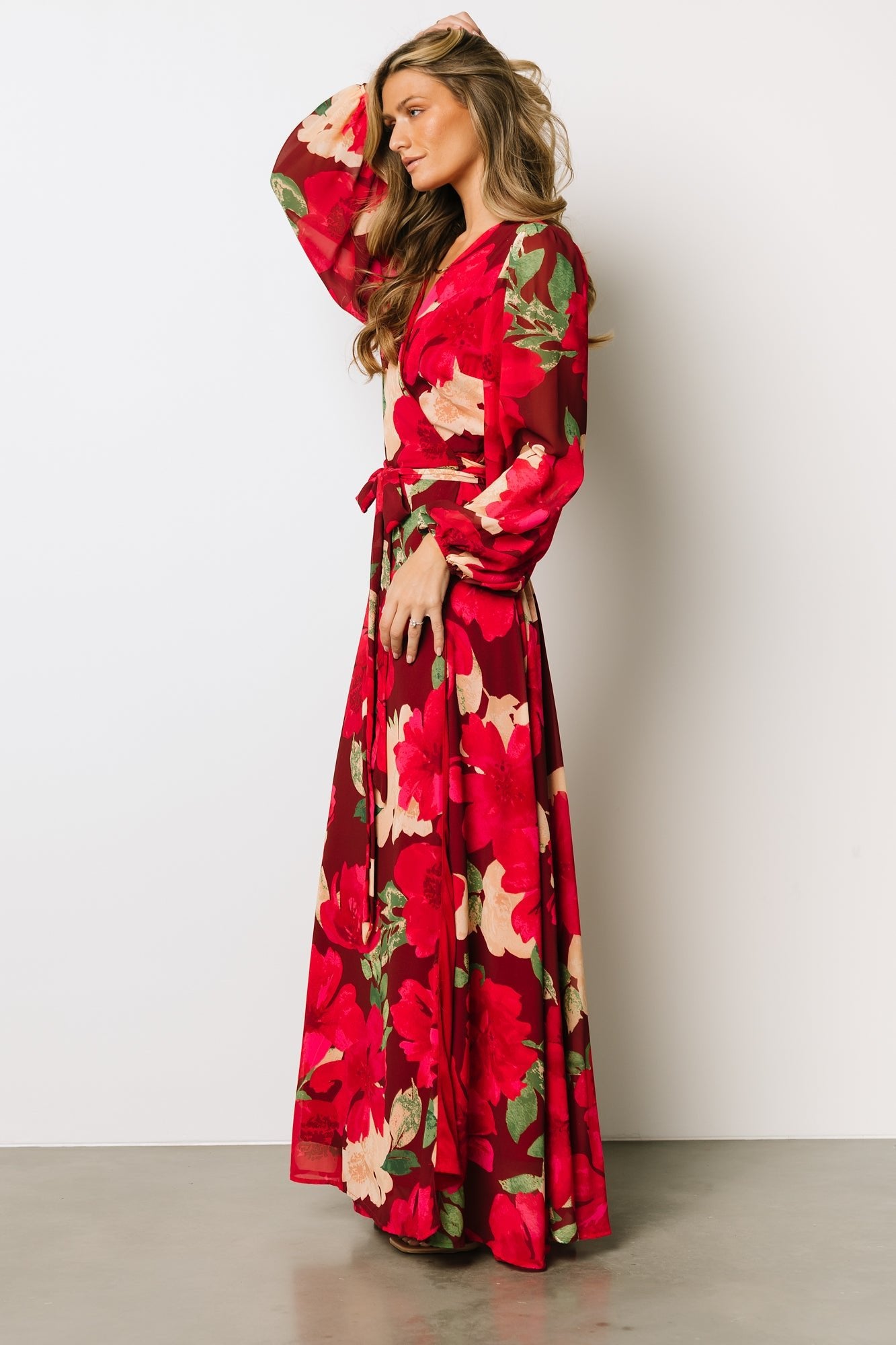 Close view of sleeve and cuff on Katinka Wrap Maxi Dress in burgundy multi floral showing elastic cuff detail and sheer sleeve finish.