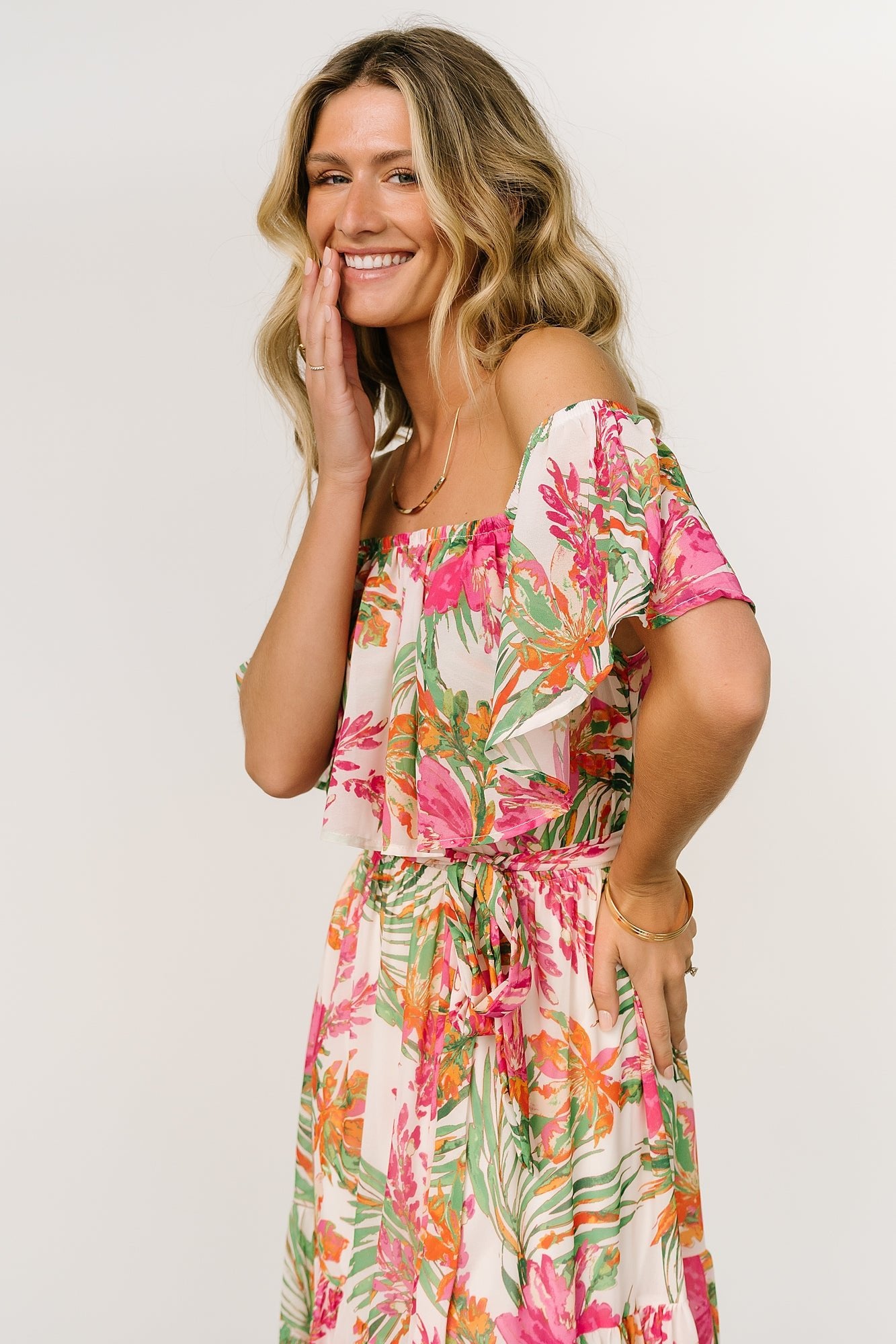 Detail of the removable sash and elastic waistband on the Lahaina maxi, showing fabric drape and waist shaping.