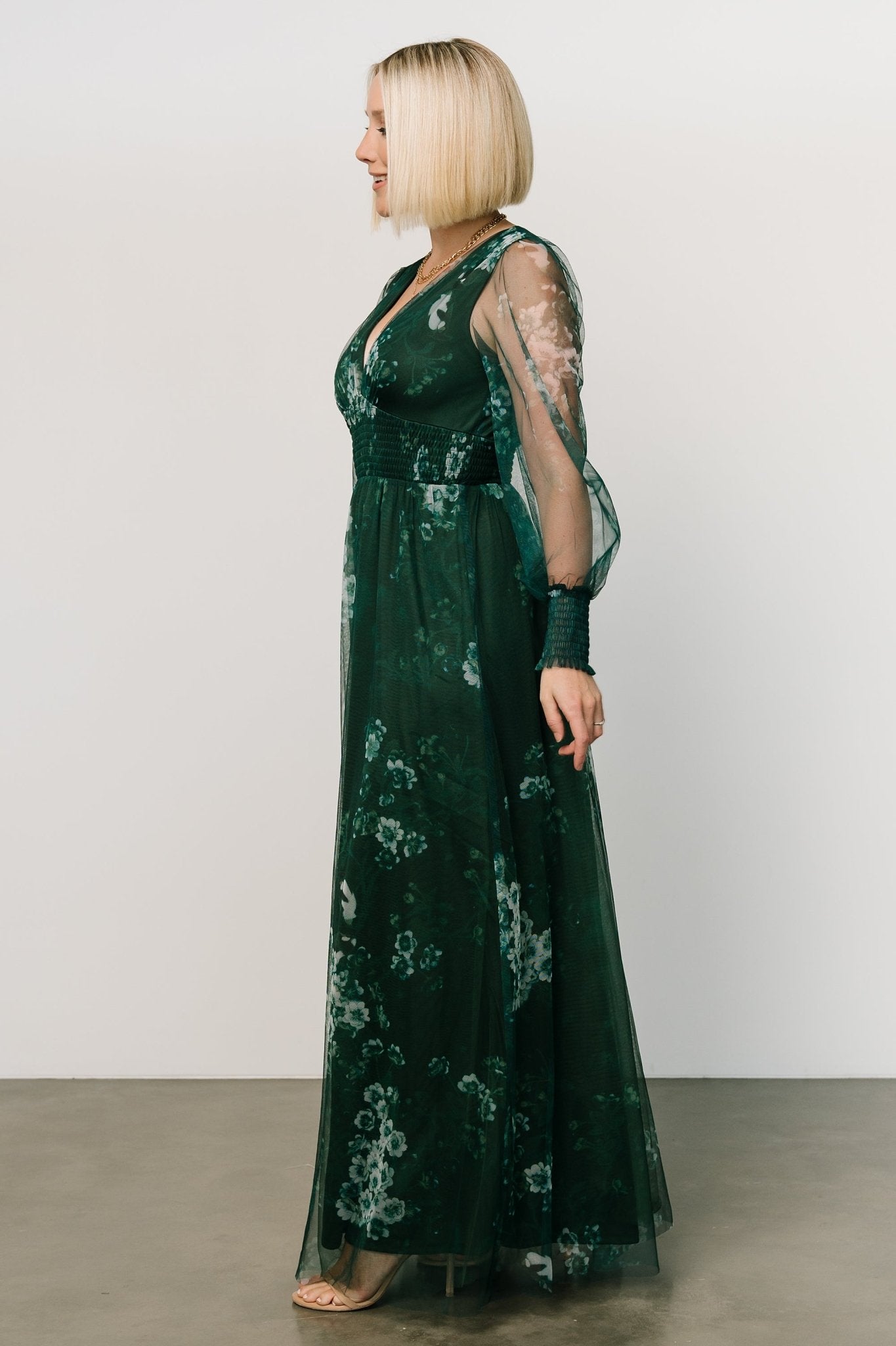 Close-up of Layla dress fabric and print in Dark Green Multi highlighting tulle texture, floral motifs, and smocked waist detail with lining visible.