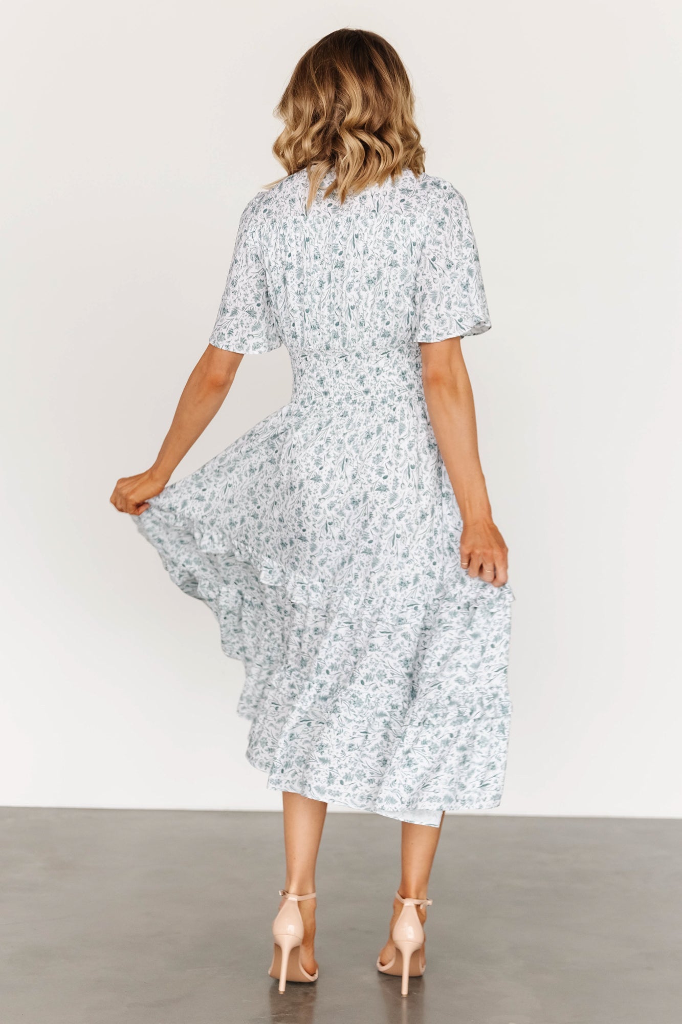 Smocked waist detail with elasticized stitching visible, demonstrating stretch and shaping at the midsection.