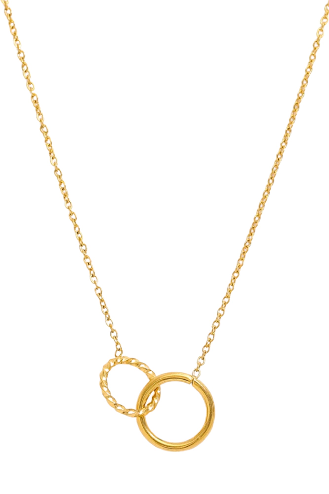 Styled product shot of The Mia Necklace draped on fabric, highlighting the polished and textured interlocking gold circles.
