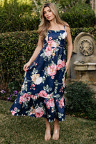 Back view of navy Cherie jacquard dress highlighting smocked back bodice and elasticized waist with adjustable straps.