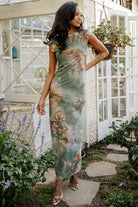 Front view of Daniela mesh midi dress in dusty sage floral with included ribbed slip, model standing in studio lighting.