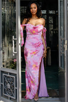 Three-quarter view of dress movement, showing tulip skirt panels and lavender floral print in soft chiffon fabric.