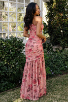 Side view of the Emeline pink floral maxi highlighting the right-side invisible zipper and the fitted silhouette through the hips.