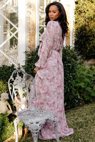 Movement shot: model walking in Ensley Maxi Dress Dusty Rose Floral, full skirt swaying from chiffon fabric.