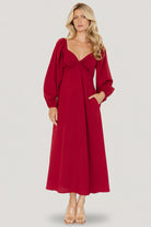 Three-quarter angle of scarlet Rosalie Back Tie Dress highlighting elastic shoulders, soft drape, and comfortable fit.